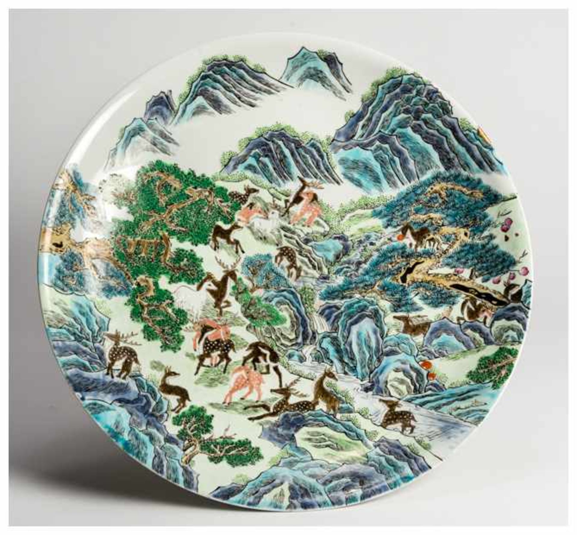 A LARGE DECORATIVE PLATE WITH 'HUNDRED DEER' MOTIF Porcelain with enamel painting. China, late