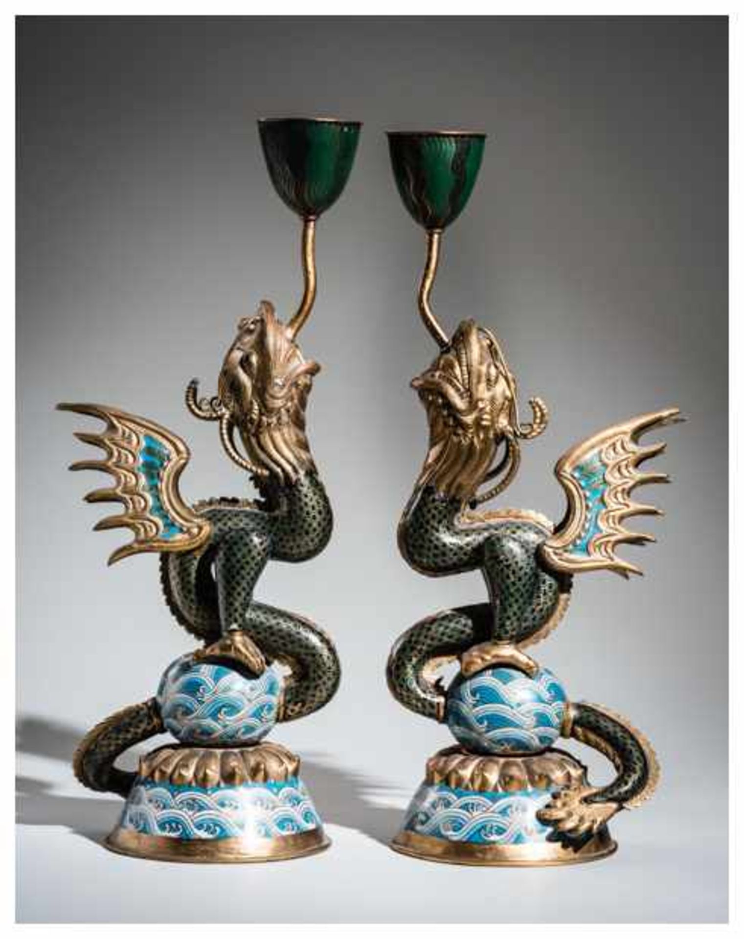 A PAIR OF CLOISONNE CANDLESTICKS IN THE FORM OF DRAGON FISH Cloisonneenamel. China, Qing dynastyA