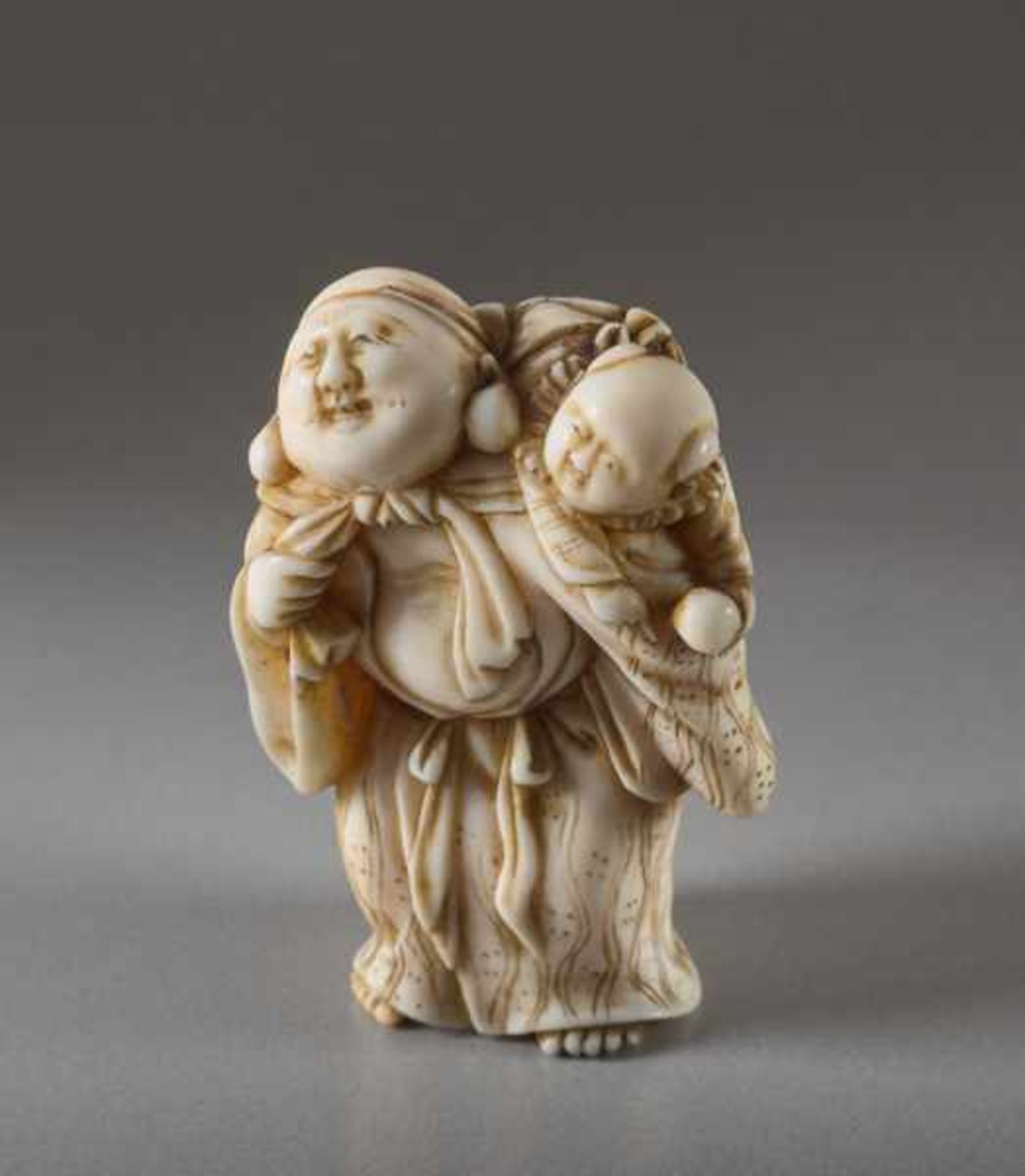 AN IVORY NETSUKE OF HOTEI WITH KARAKO Ivory netsuke. Japan, early 19th centuryA very lively - Image 2 of 5