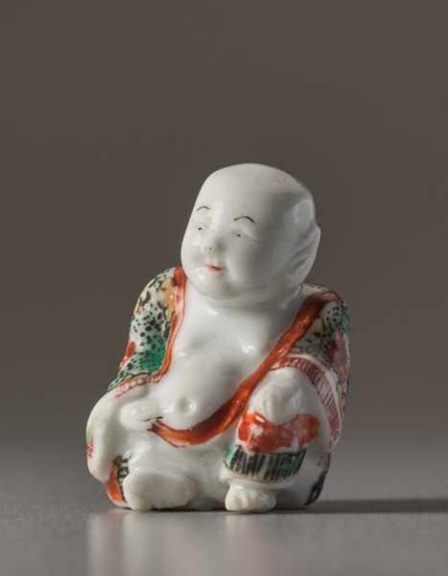 A PORCELAIN NETSUKE OF HOTEI Porcelain netsuke with enamel colors. Japan, Meiji periodA very fine - Image 2 of 5