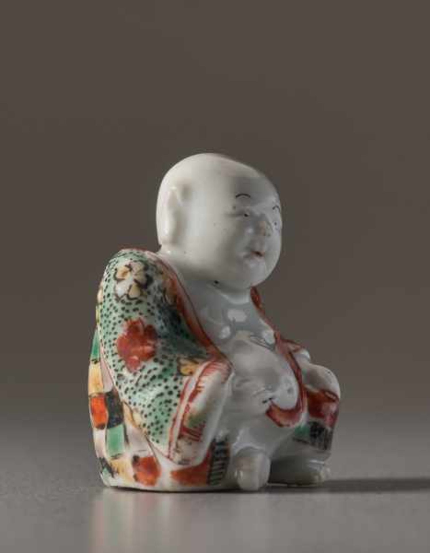 A PORCELAIN NETSUKE OF HOTEI Porcelain netsuke with enamel colors. Japan, Meiji periodA very fine - Image 4 of 5