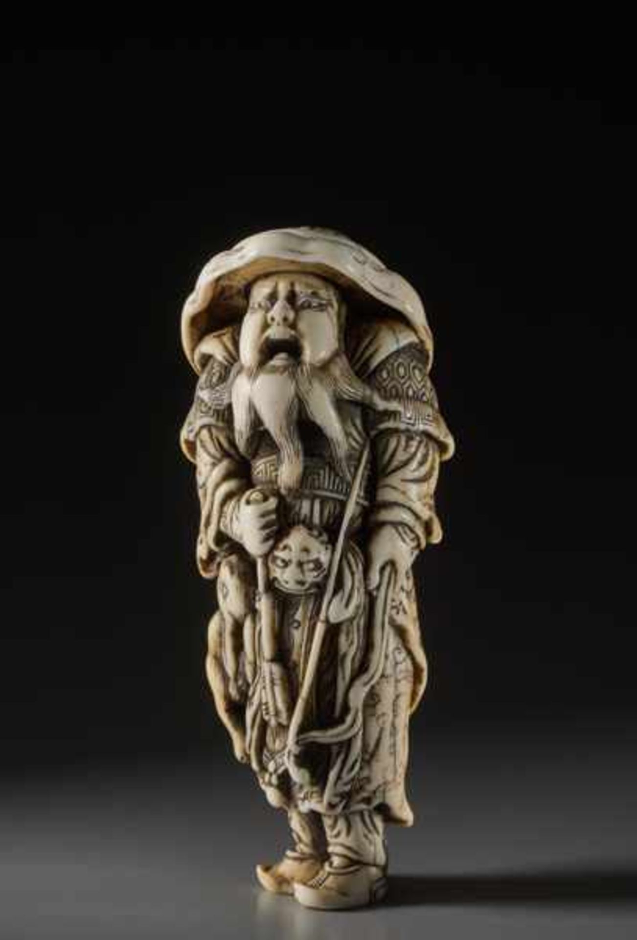 AN IMPORTANT TALL IVORY NETSUKE OF A MONGOLIAN ARCHER Ivory netsuke. Japan, 18th centuryWorks like