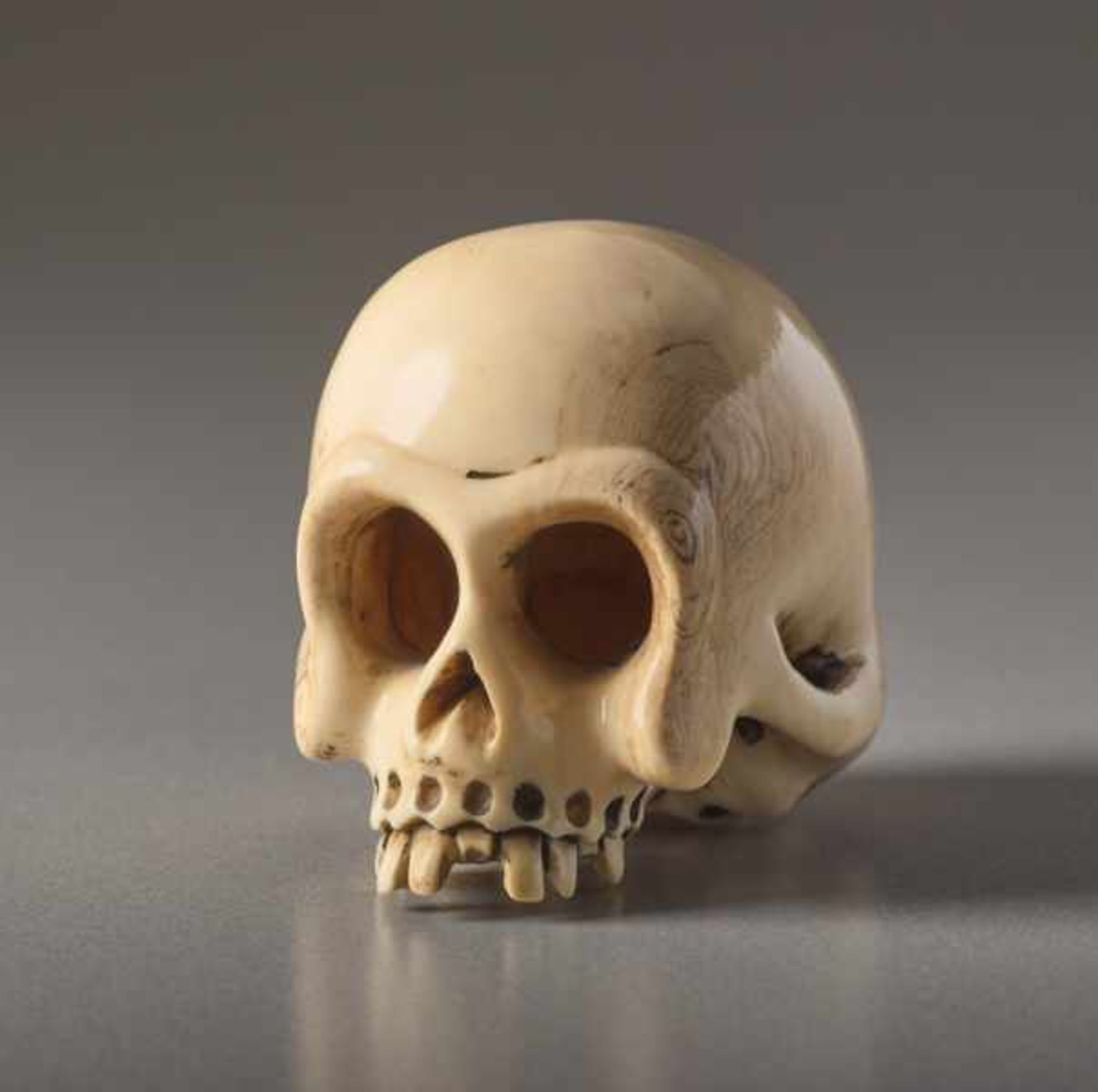 AN IVORY NETSUKE BY SHOZAN OF A SKULL Ivory netsuke. Japan, 19th centuryAn excellently crafted, - Image 2 of 7