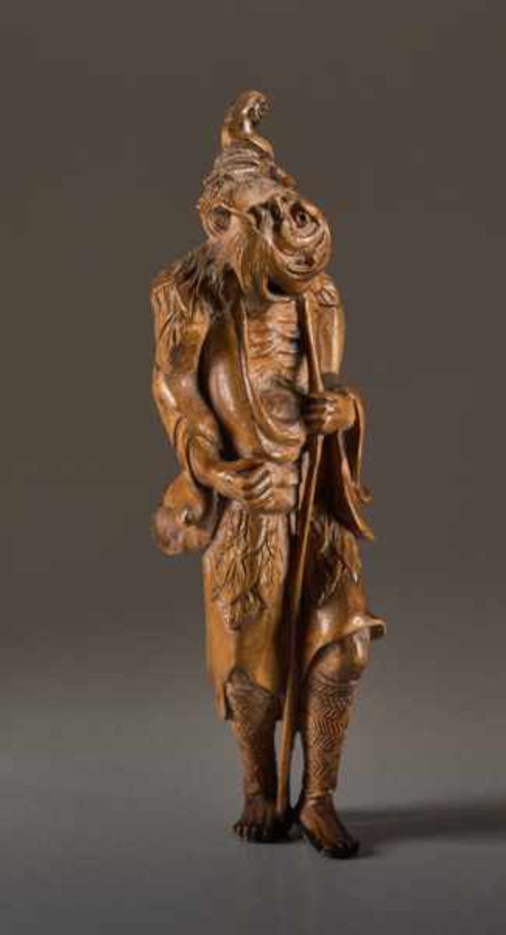 A TALL WOOD NETSUKE OF TEKKAI SENNIN Wood netsuke. Japan, 19th centuryThe immortal with his iron - Image 6 of 8