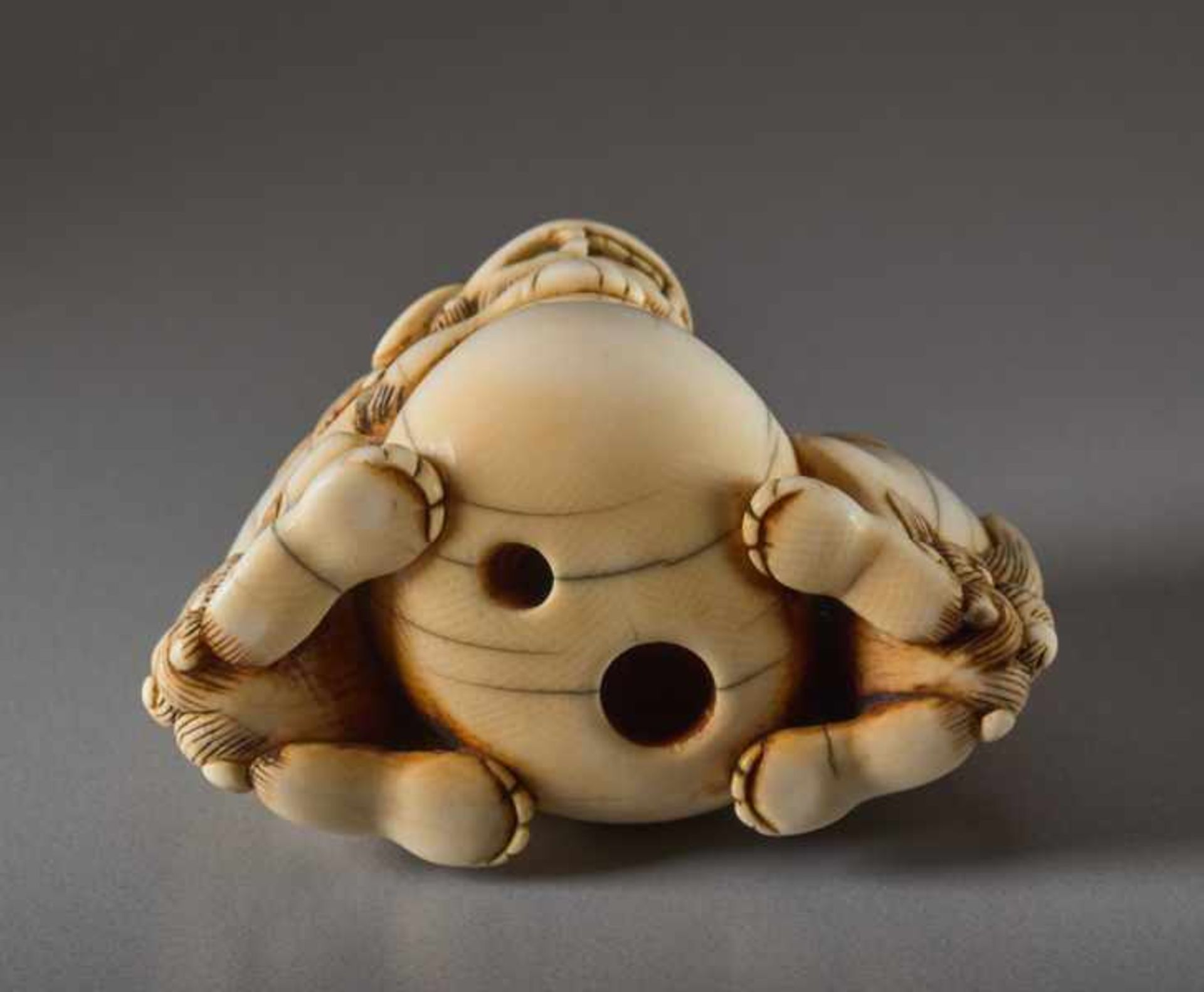 AN IVORY NETSUKE OF TWO SHISHI AND BALL Ivory netsuke. Japan, 18th centuryThe lion dog has a movable - Image 6 of 6