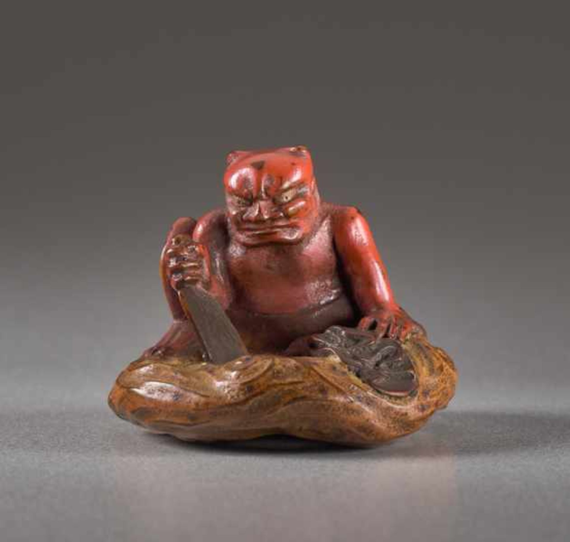 A LACQUER NETSUKE OF THE WIND GOD FUTEN Lacquer netsuke. Japan, 19th centuryFuten, the god of the