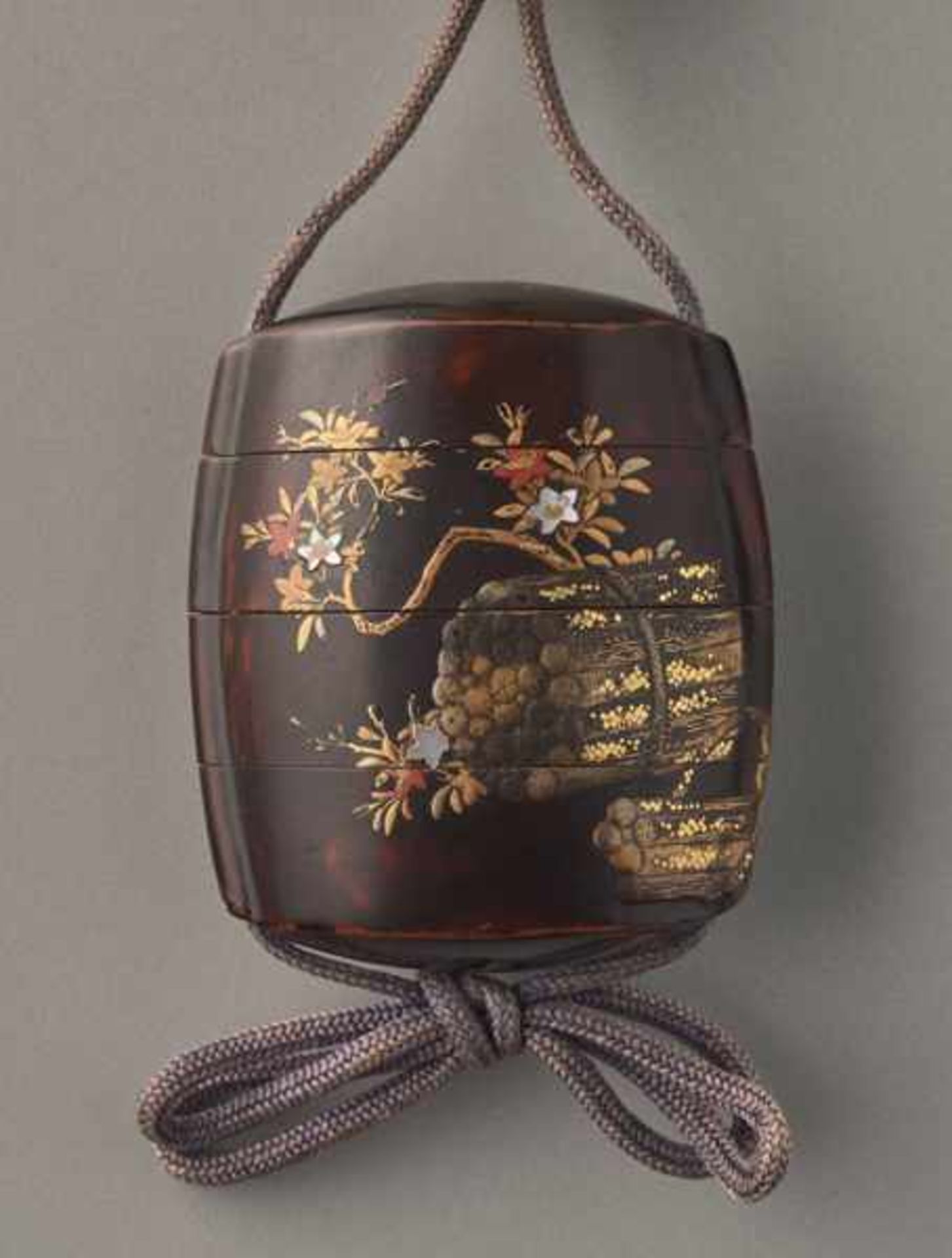 AN UNUSUAL LACQUER AND GOLD INRO OF BLOSSOMS AND SCROLL PA INTINGS Lacquer and gold inro with