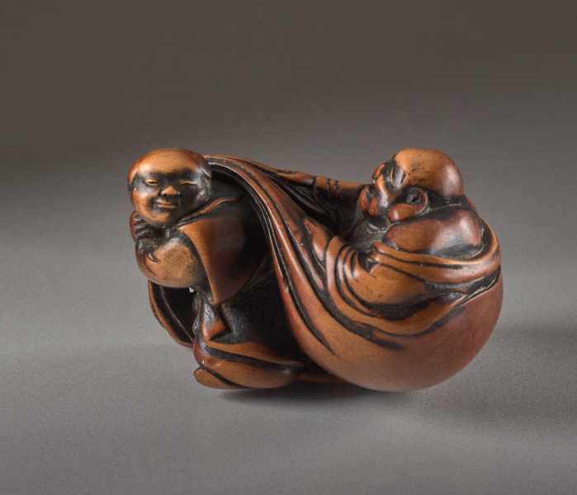 A WOOD NETSUKE OF HOTEI Wood netsuke. Japan, 19th centuryThe ever-laughing Hotei, the most popular - Image 4 of 5