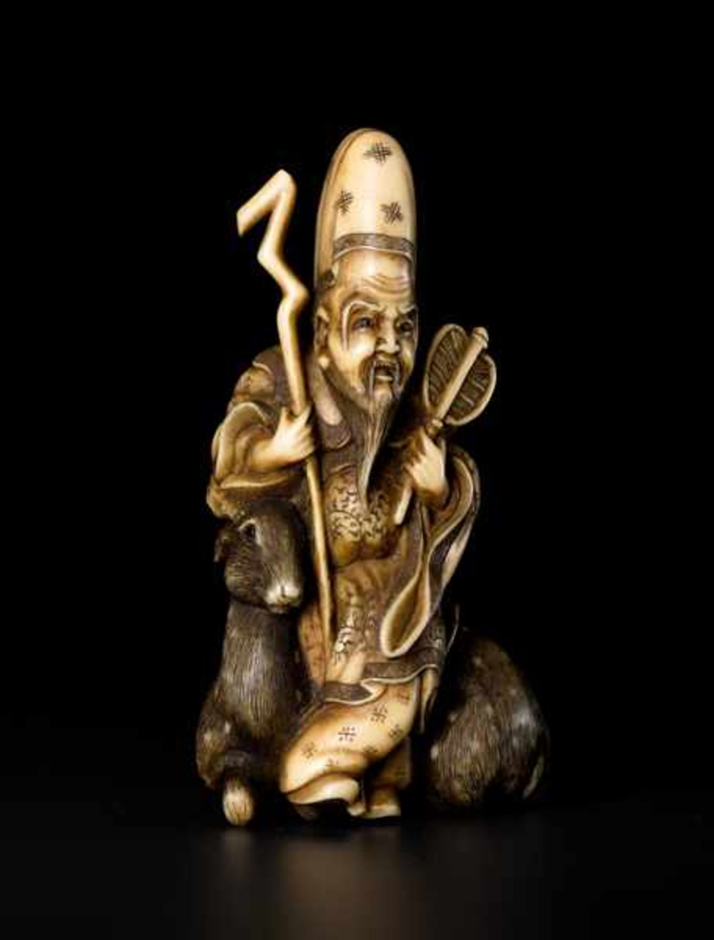 AN IVORY NETSUKE OF JUROJIN Ivory netsuke. Japan, 19th centuryJurojin, Japanese for “long-lived, old