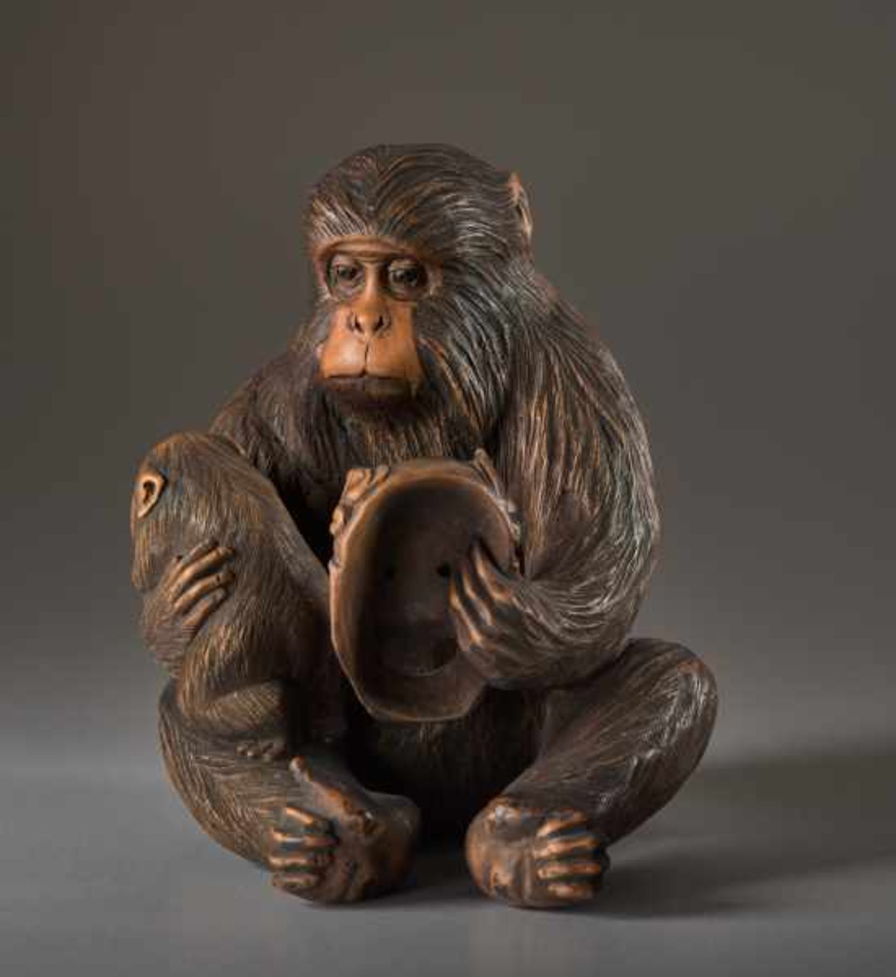 A WOOD OKIMONO BY JIGO OF A MONKEY WITH CHILD AND MASK Wood okimono. Japan, Meiji periodThe monkey - Image 2 of 5