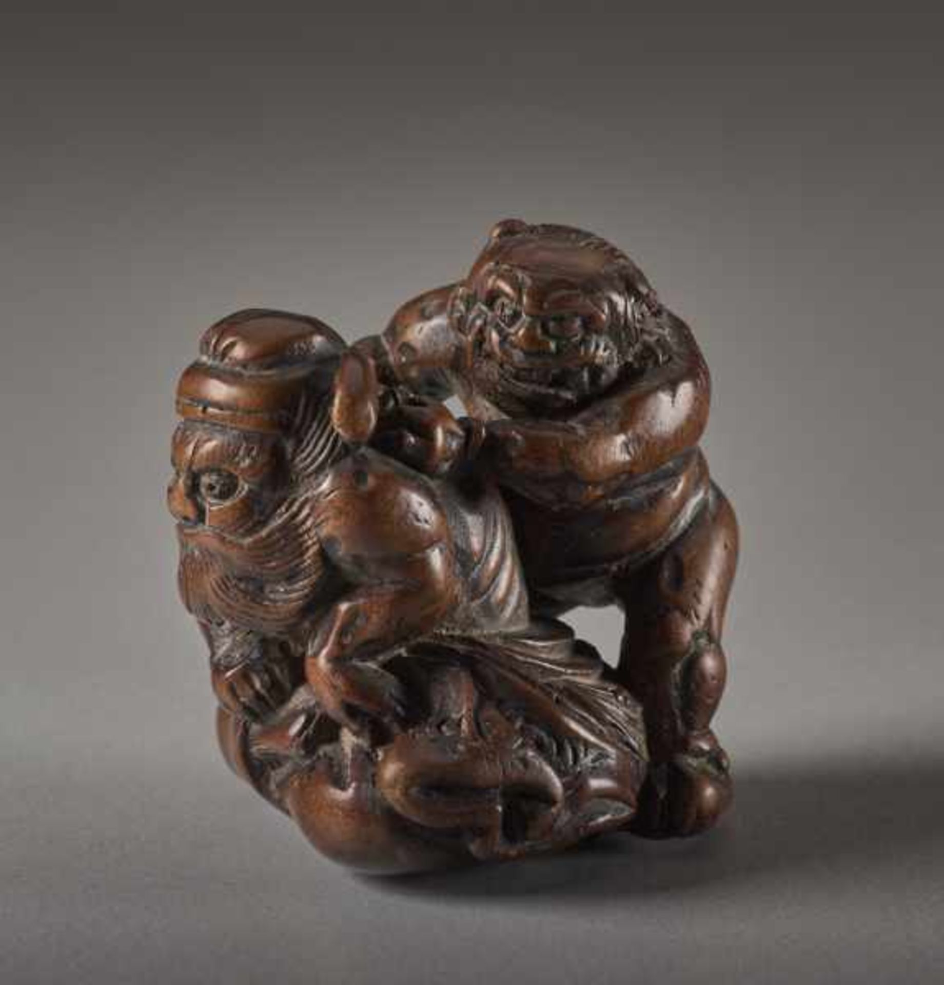 A WOOD NETSUKE OF THE DEMON QUELLER SHOKI WITH ONI Wood netsuke. Japan, 19th centuryThe famous - Image 2 of 6