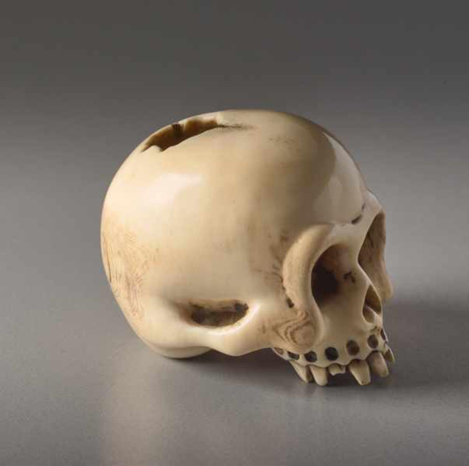 AN IVORY NETSUKE BY SHOZAN OF A SKULL Ivory netsuke. Japan, 19th centuryAn excellently crafted, - Image 3 of 7