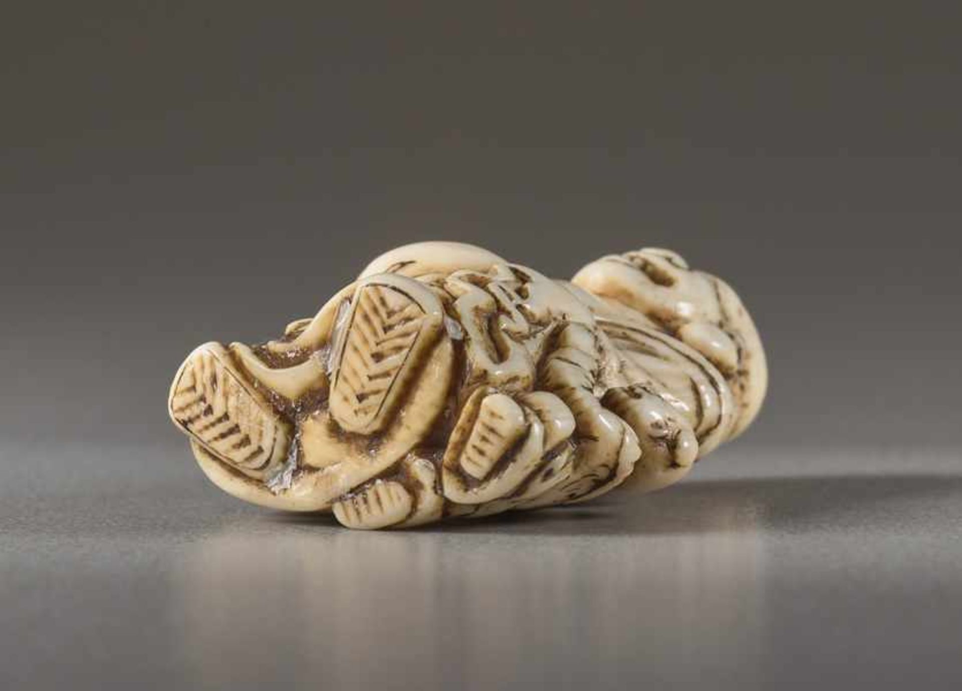 A SMALL IVORY NETSUKE OF HOTEI Ivory netsuke. Japan, early 19th centuryA delightful depiction of - Image 6 of 6