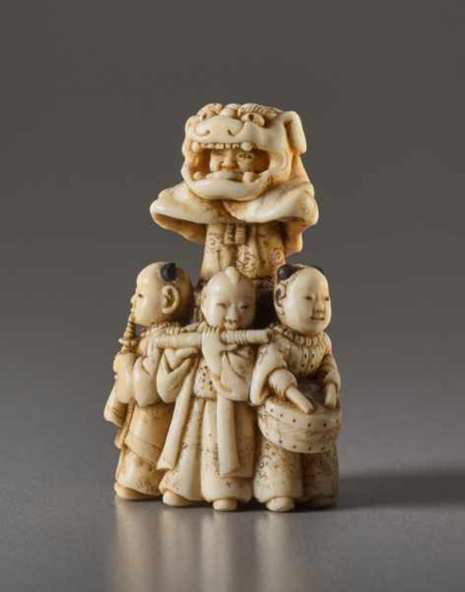 AN IVORY NETSUKE OF THE LION DANCE SHISHIMAI Ivory netsuke. Japan, 19th centuryA very amusing