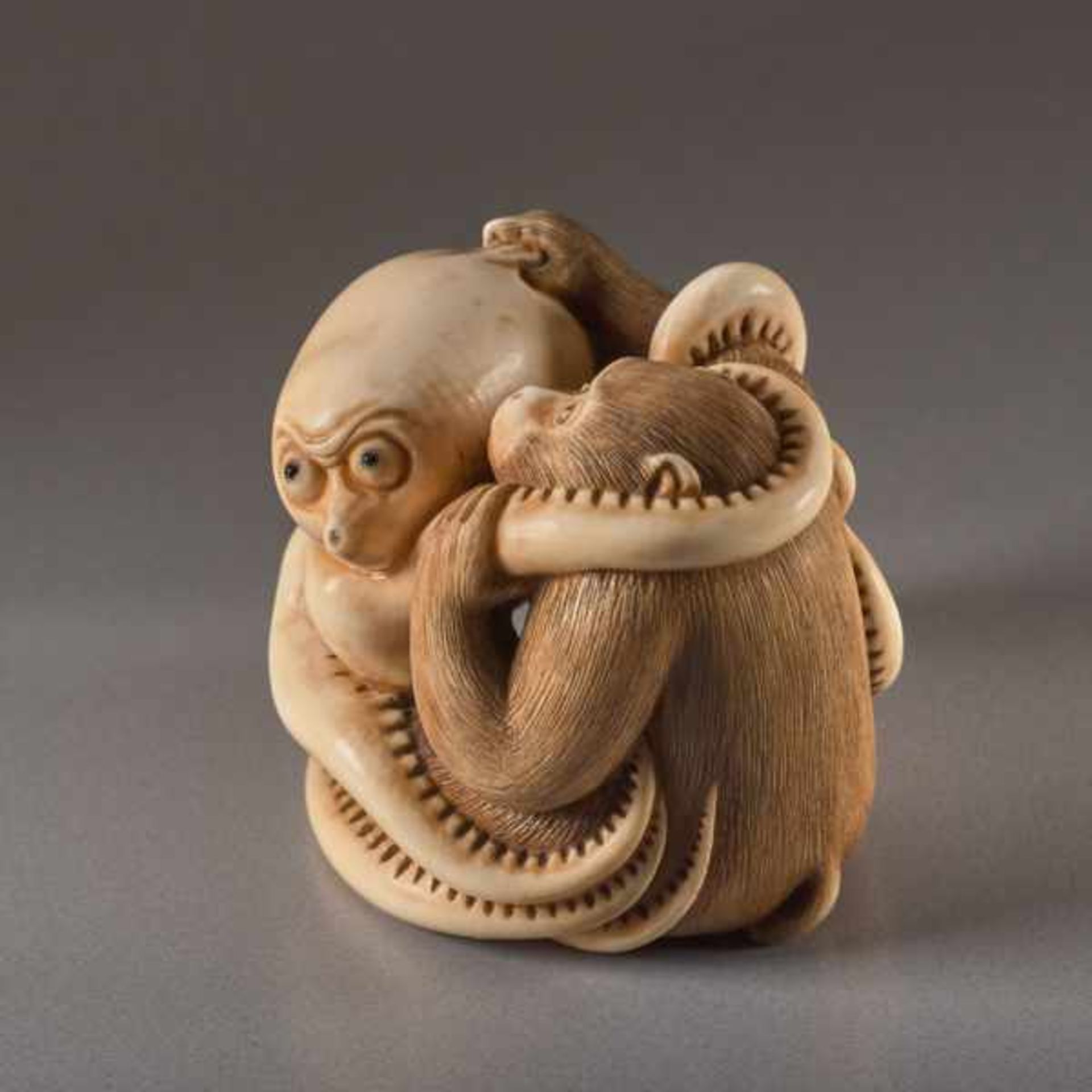 AN IVORY NETSUKE BY IKKOSAI TOUN OF A MONKEY AND OCTOPUS Ivory netsuke. Japan, 19th century, Meiji - Image 2 of 4