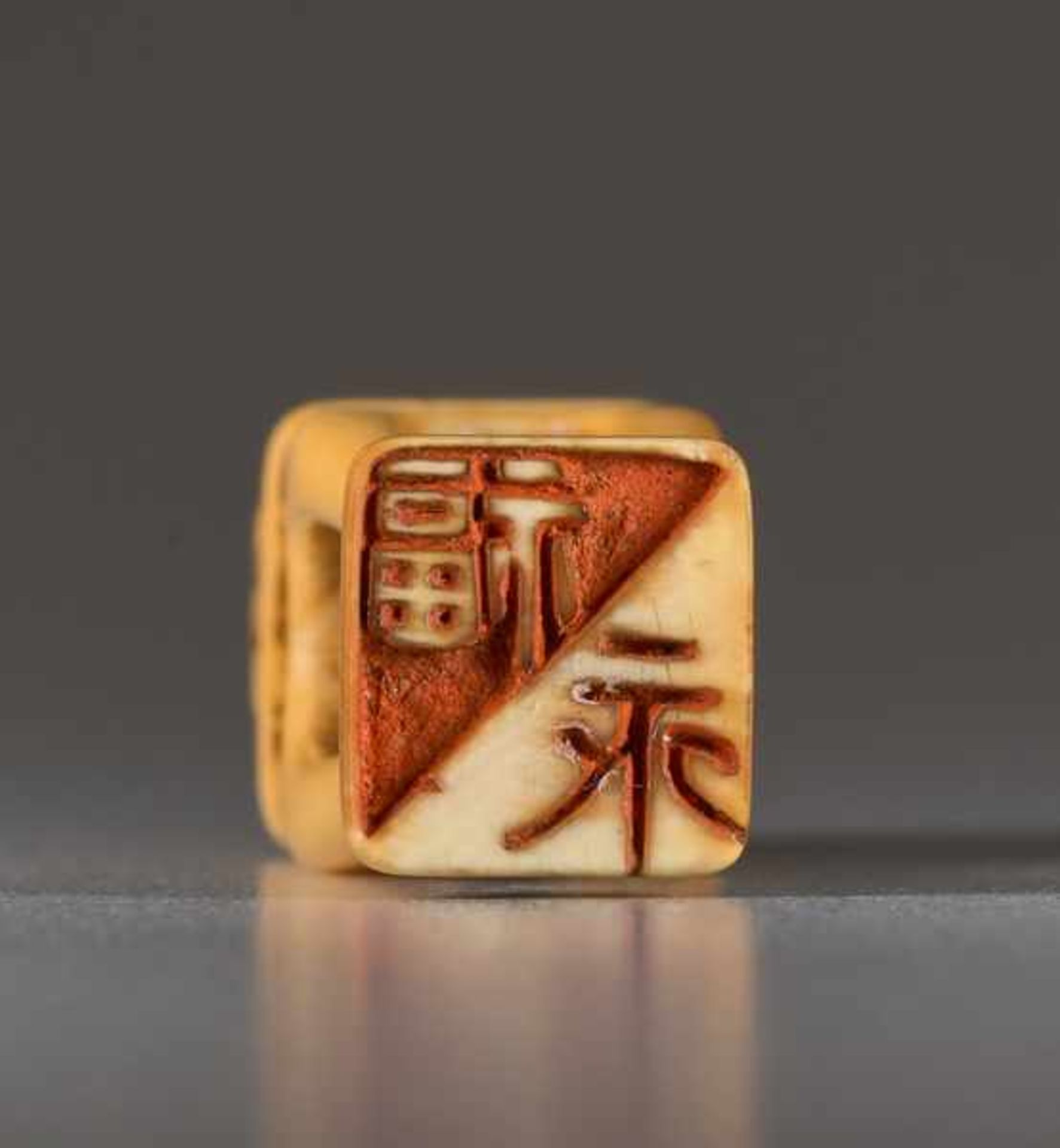 AN IVORY NETSUKE OF A SHISHI ON A PEDESTAL Ivory netsuke. Japan, 19th centuryA very unusually shaped - Image 5 of 5