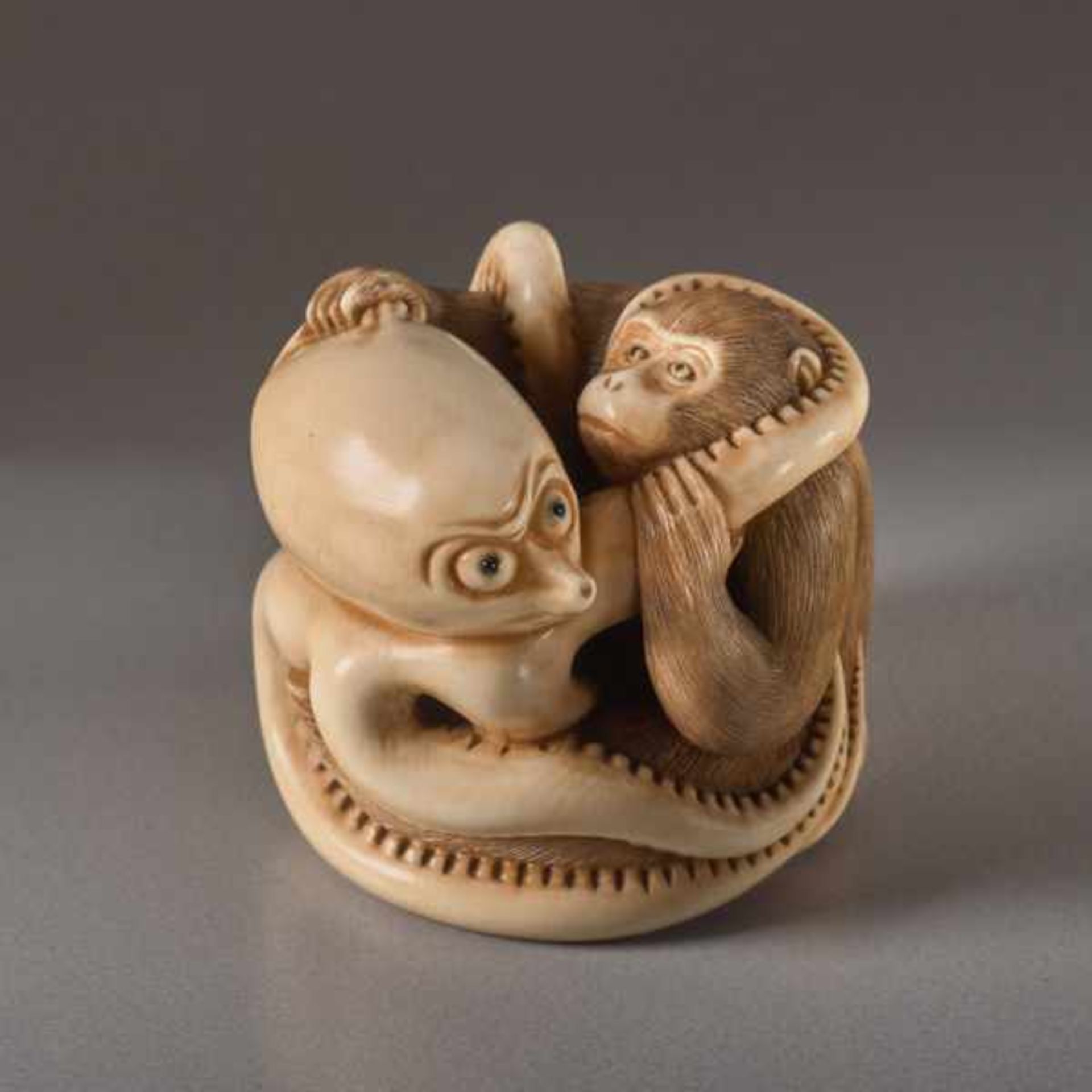 AN IVORY NETSUKE BY IKKOSAI TOUN OF A MONKEY AND OCTOPUS Ivory netsuke. Japan, 19th century, Meiji