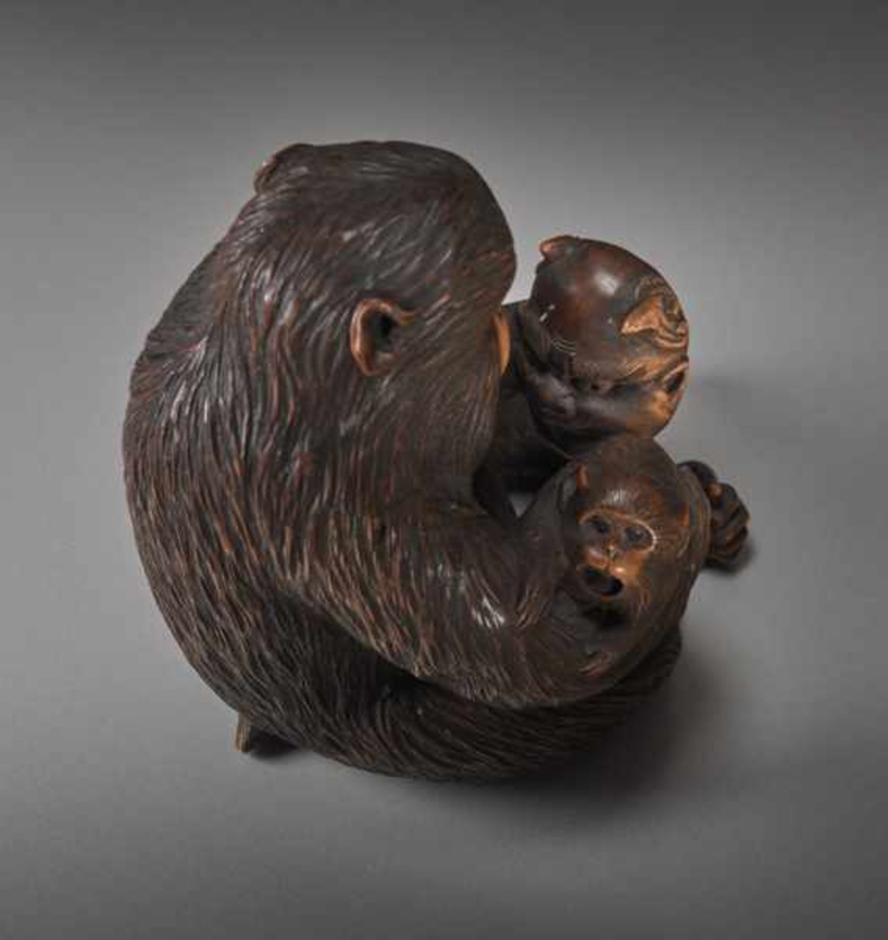 A WOOD OKIMONO BY JIGO OF A MONKEY WITH CHILD AND MASK Wood okimono. Japan, Meiji periodThe monkey - Image 5 of 5