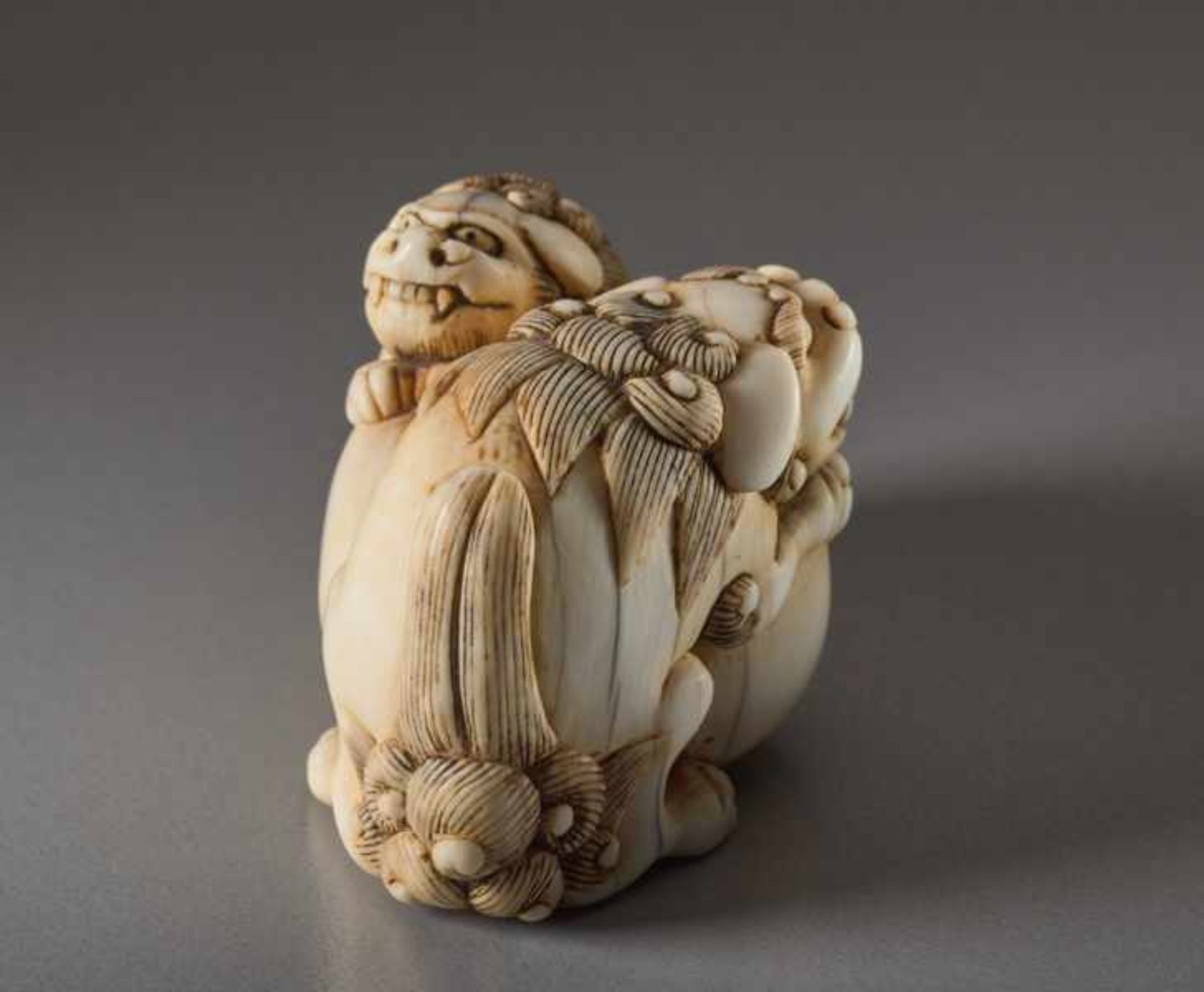 AN IVORY NETSUKE OF TWO SHISHI AND BALL Ivory netsuke. Japan, 18th centuryThe lion dog has a movable - Image 4 of 6