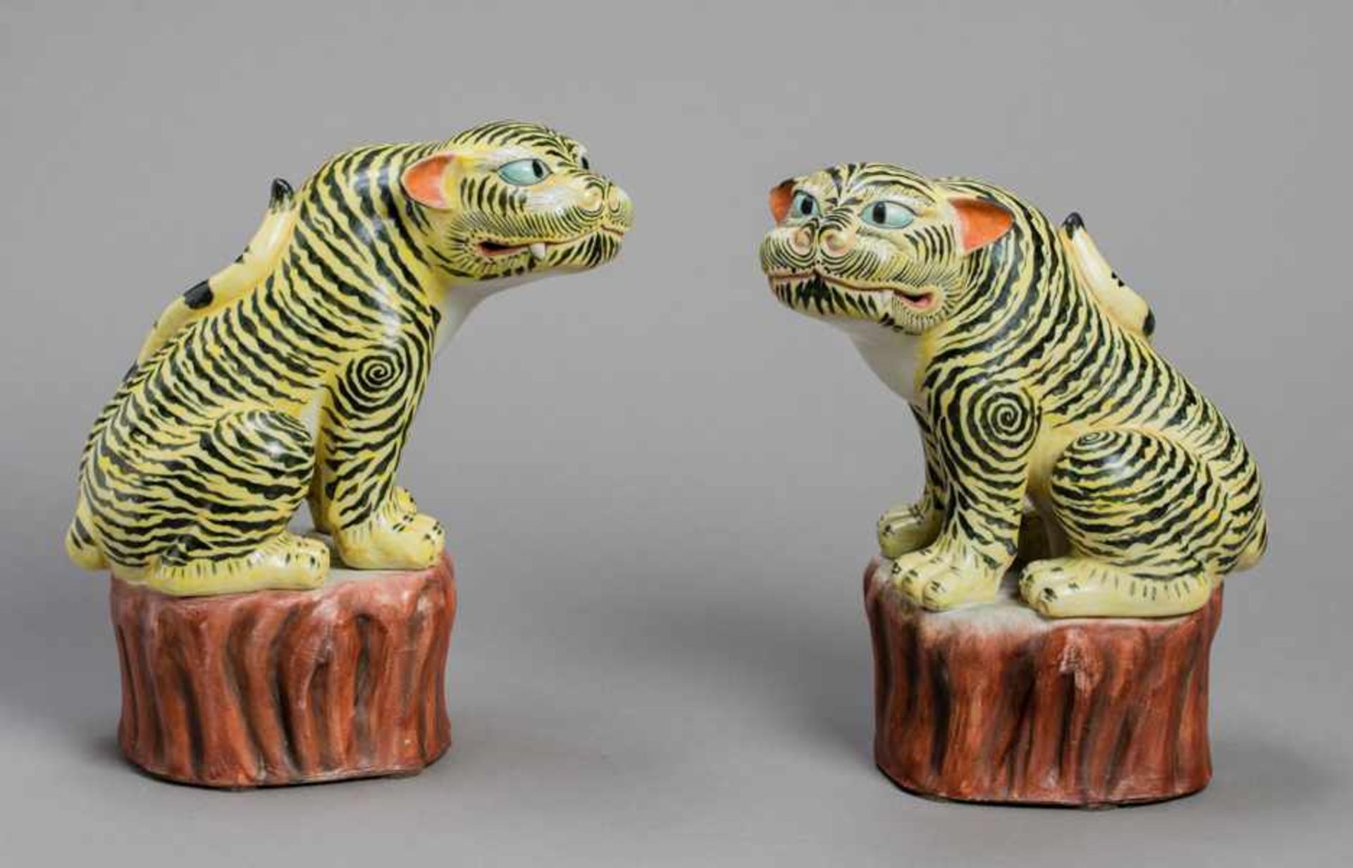 A RARE PAIR OF KAKIEMON MODELS OF TIGERS Ceramic and enamel painting. Japan, 19th centuryEach seated