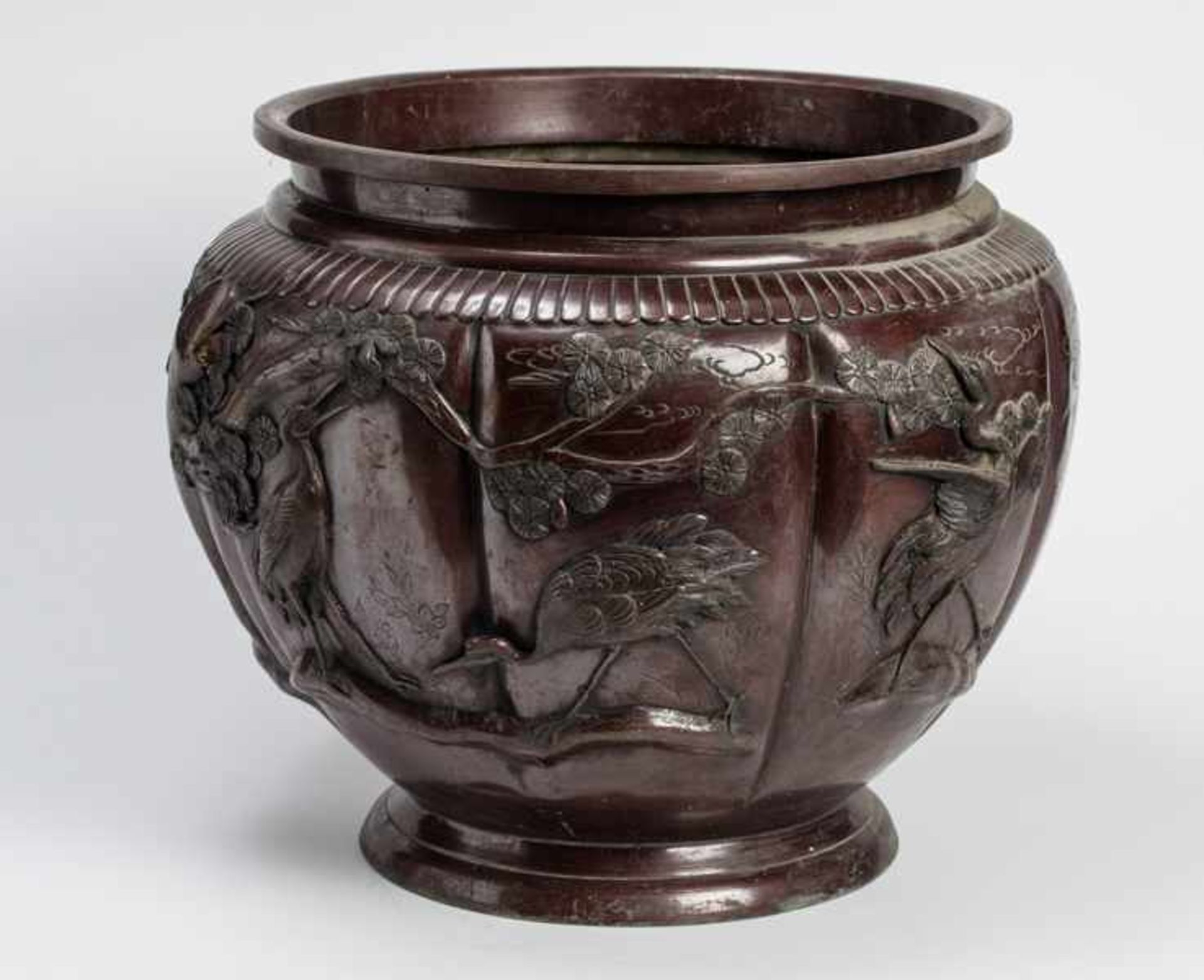 A LARGE BRONZE CACHEPOT WITH CRANES Bronze. Japan, Meiji periodOf globular form, in a reddishbrown