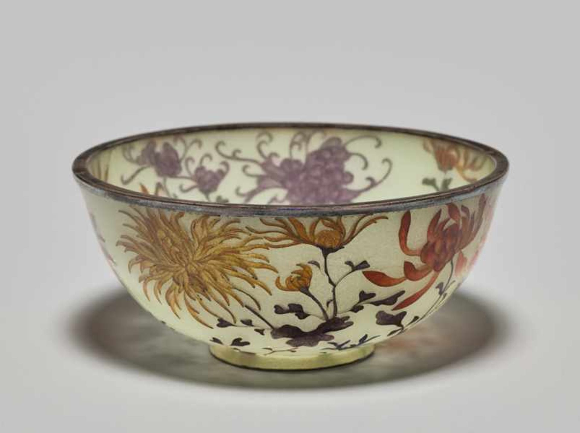 A PLIQUE-À-JOUR BOWL WITH CHRYSANTHEMUMS Colored plique-à-jour, enamel and silver. Japan, Meiji