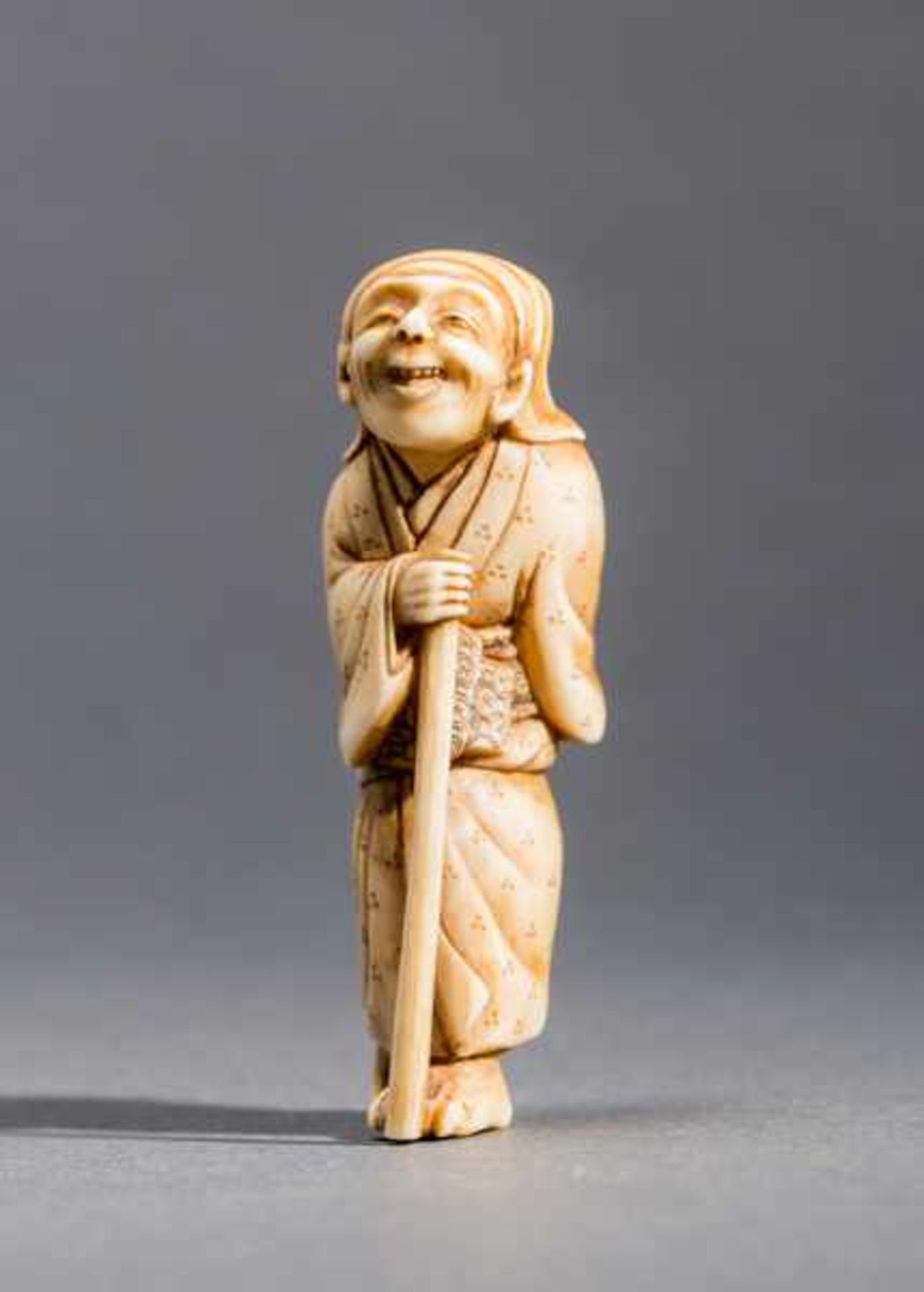 OLD MAN WITH WALKING STICK Ivory. Japan, 19th centuryMeticulously carved piece. An old and