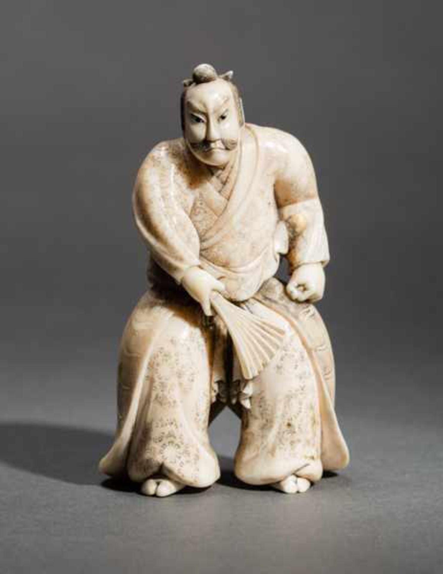 AN IVORY OKIMONO BY MASAJO OF A SAMURAI Ivory okimono. Japan, Meiji periodThis okimono shows a
