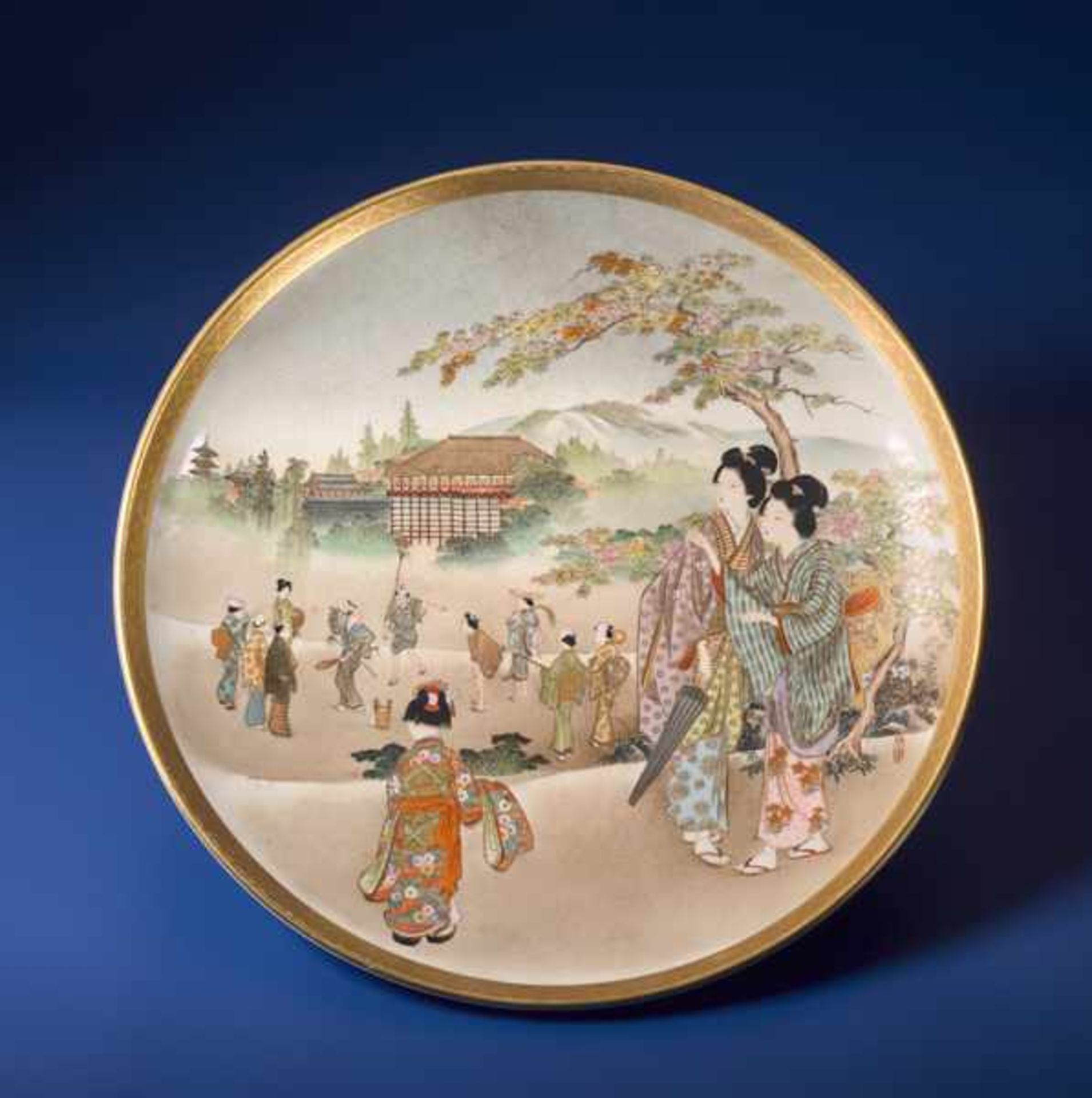 KINKOZAN: A SATSUMA PLATE WITH YOUNG LADIES Glazed ceramic with paint and gold. Japan, Meiji