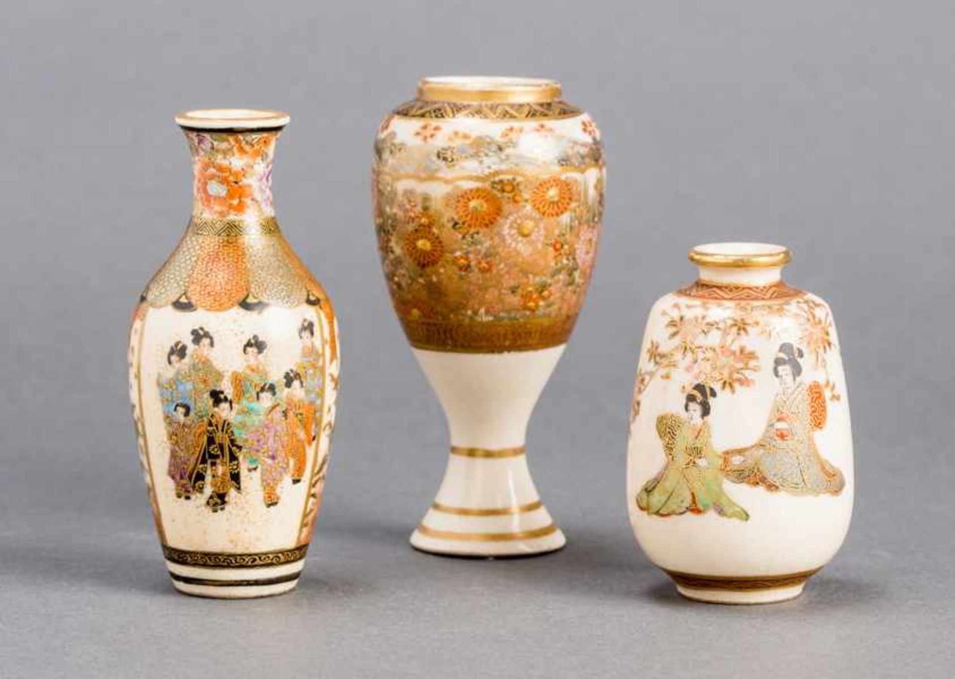 THREE SATSUMA VASES Glazed ceramic with paint and gold. Japan, Meiji periodThe first small vase