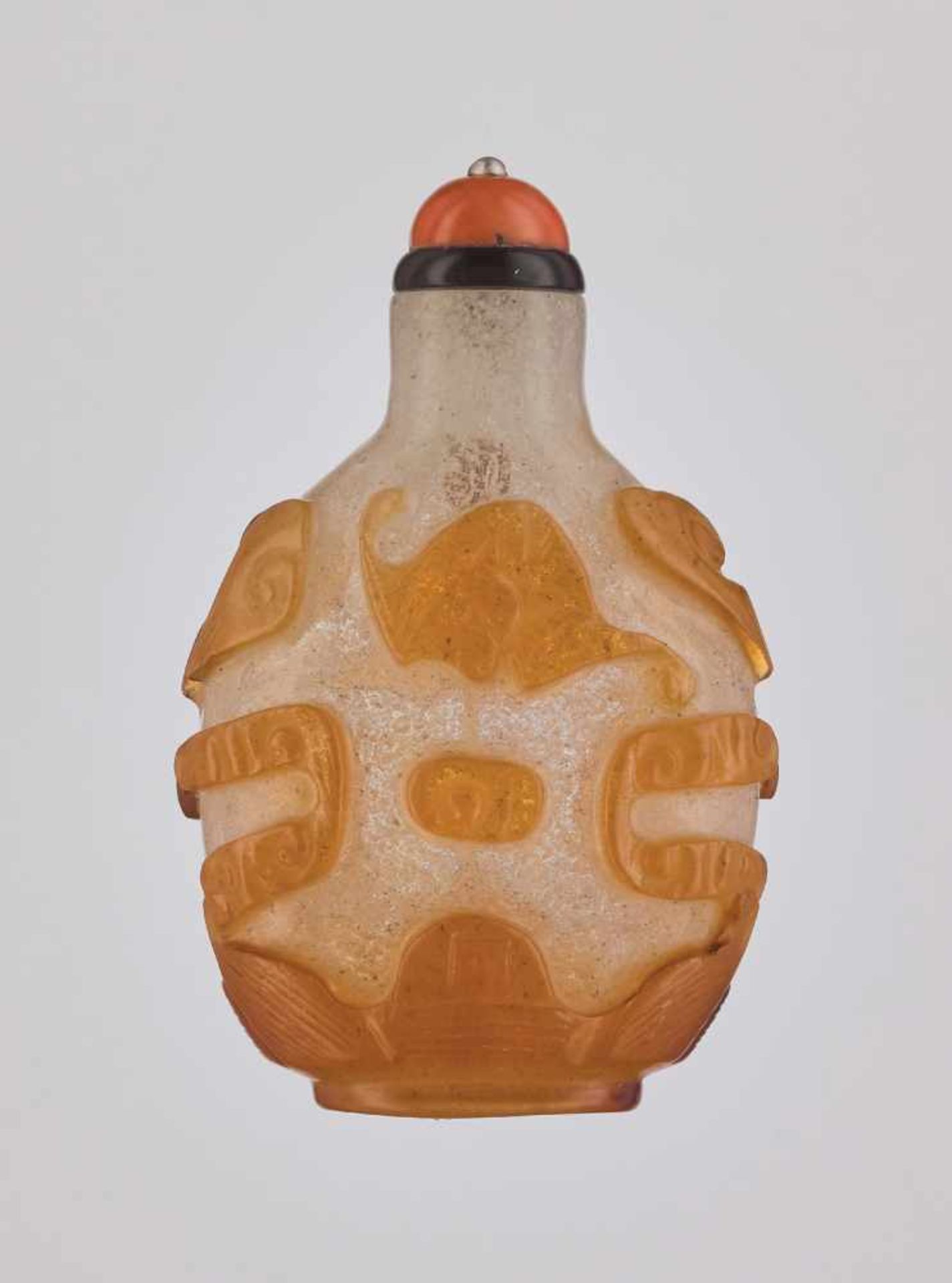 AN AMBER-COLORED OVERLAY ‘BATS’ GLASS SNUFF BOTTLE Carved translucent amber-colored overlay on