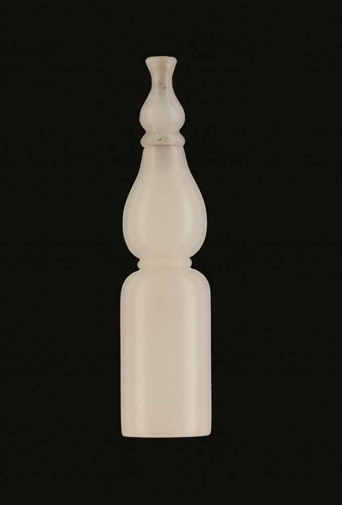 A WHITE JADE SNUFF BOTTLE, CONVERTED FROM A HOOKAH MOUTHPIECE Nephrite of even white color and