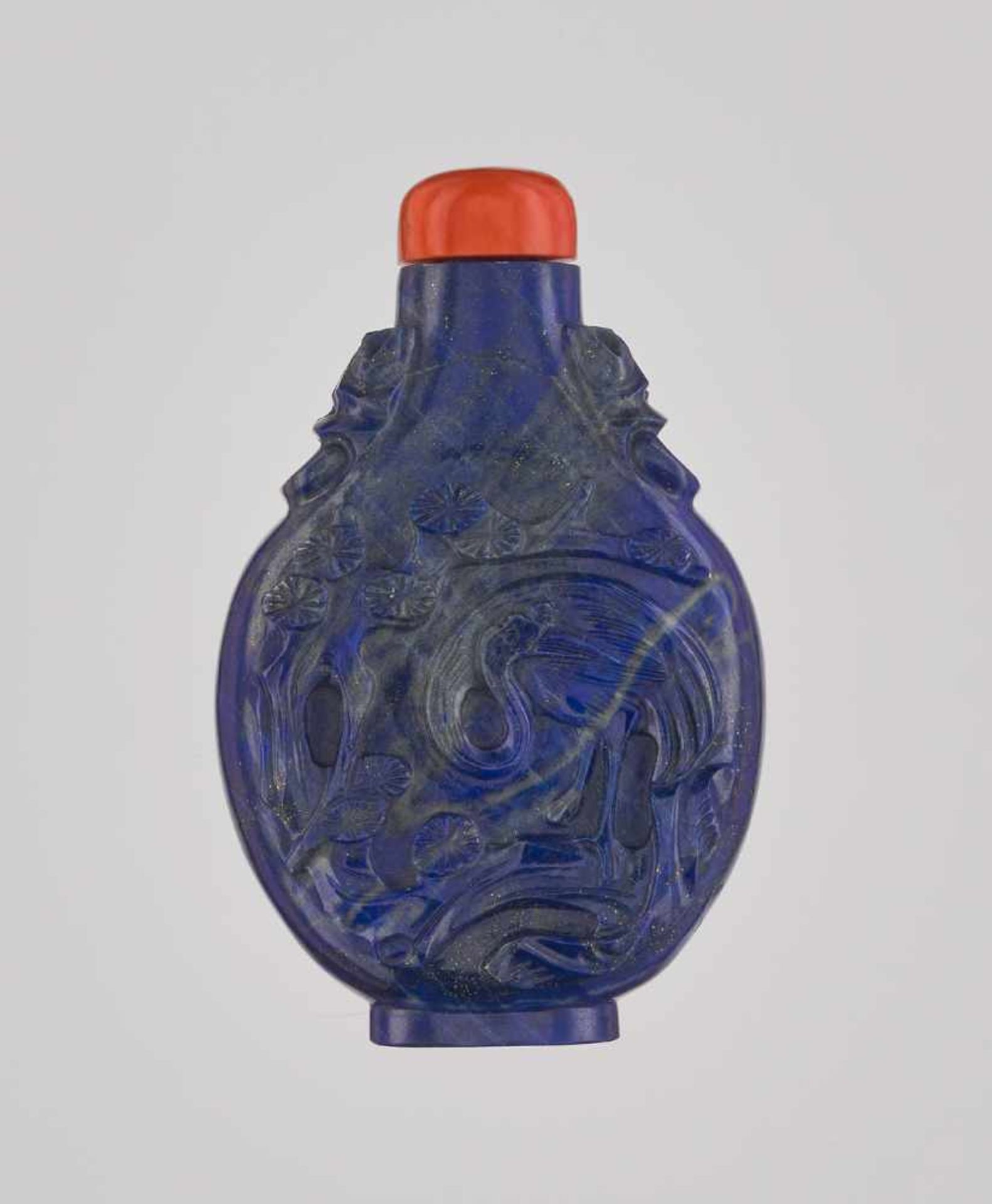 A LAPIS LAZULI ‘CRANE AND TREE’ SNUFF BOTTLE, QING DYNASTY Lapis lazuli of good, intense color, with