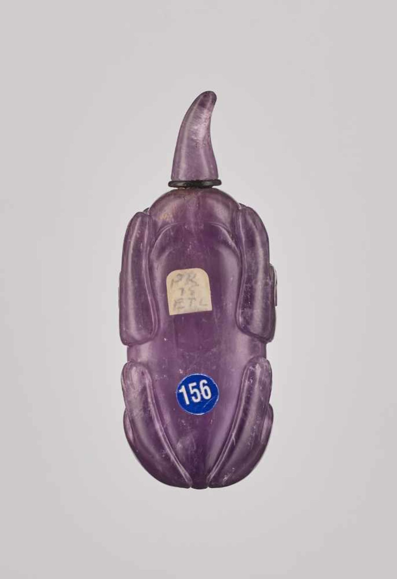 A CARVED AMETHYST AND BROWN CRYSTAL 'BUDDHIST LION' SNUFF BOTTLE Crystal (amethyst and brown - Image 2 of 6