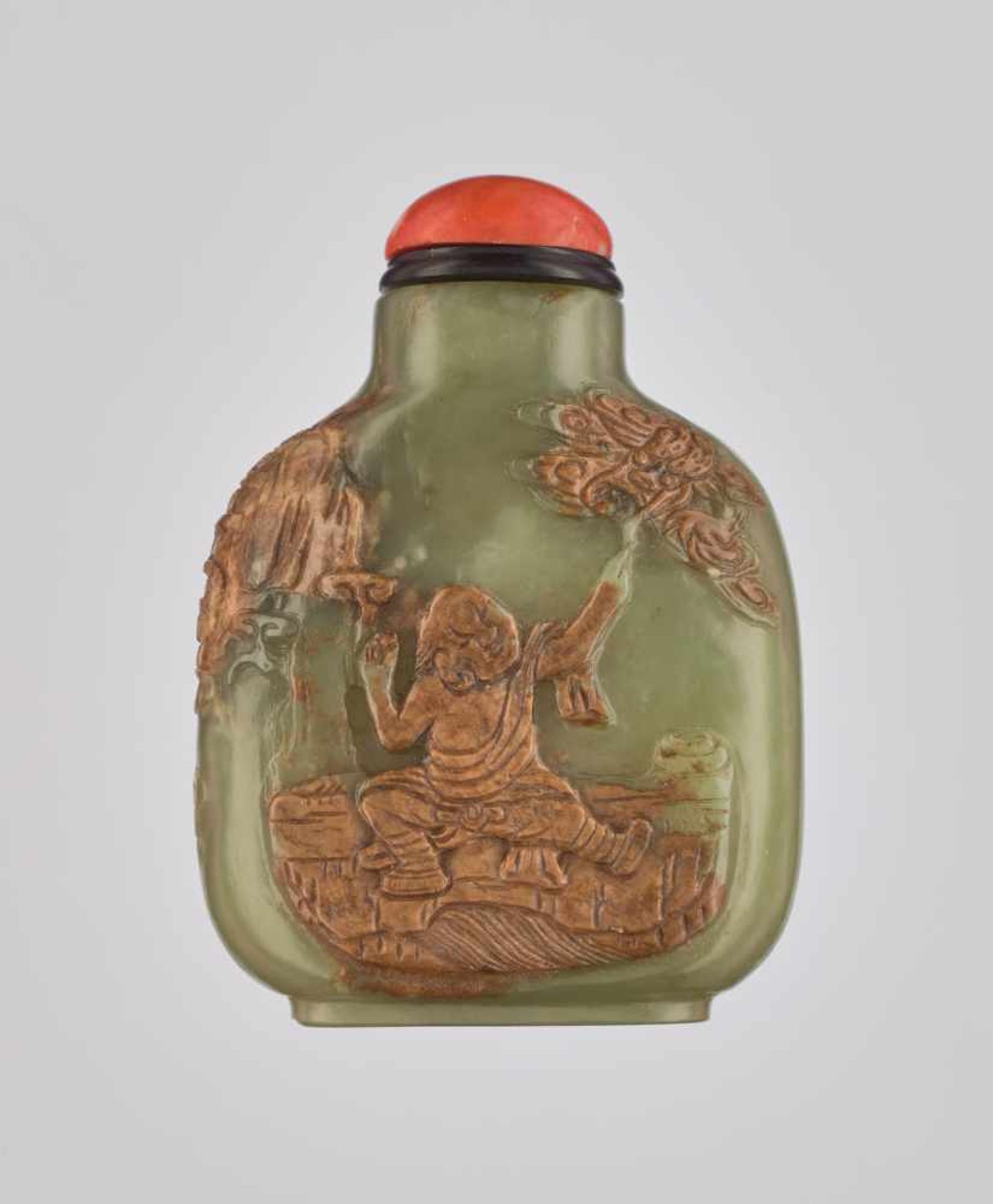 A FINELY CARVED YELLOWISH-GREEN AND RUSSET JADE 'IMMORTAL' SNUFF BOTTLE Nephrite with a natural