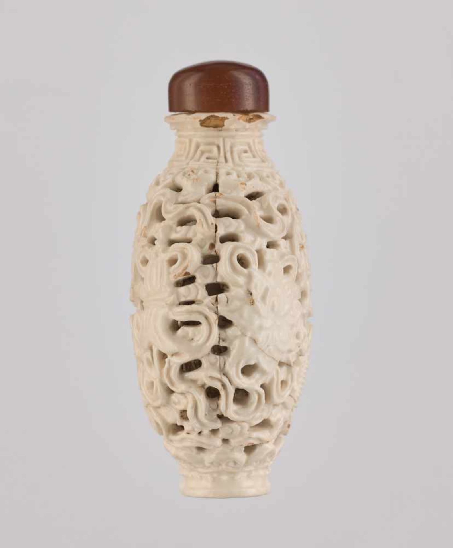 A RETICULATED WHITE PORCELAIN 'BA JIXIANG' SNUFF BOTTLE Crackled creamy-white glaze on molded and - Image 3 of 6