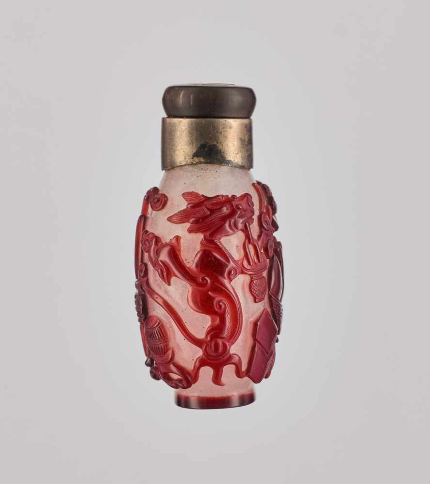 A RUBY-RED OVERLAY WHITE GLASS 'AUSPICIOUS OBJECTS' SNUFF BOTTLE, QING DYNASTY Carved and incised - Image 3 of 6