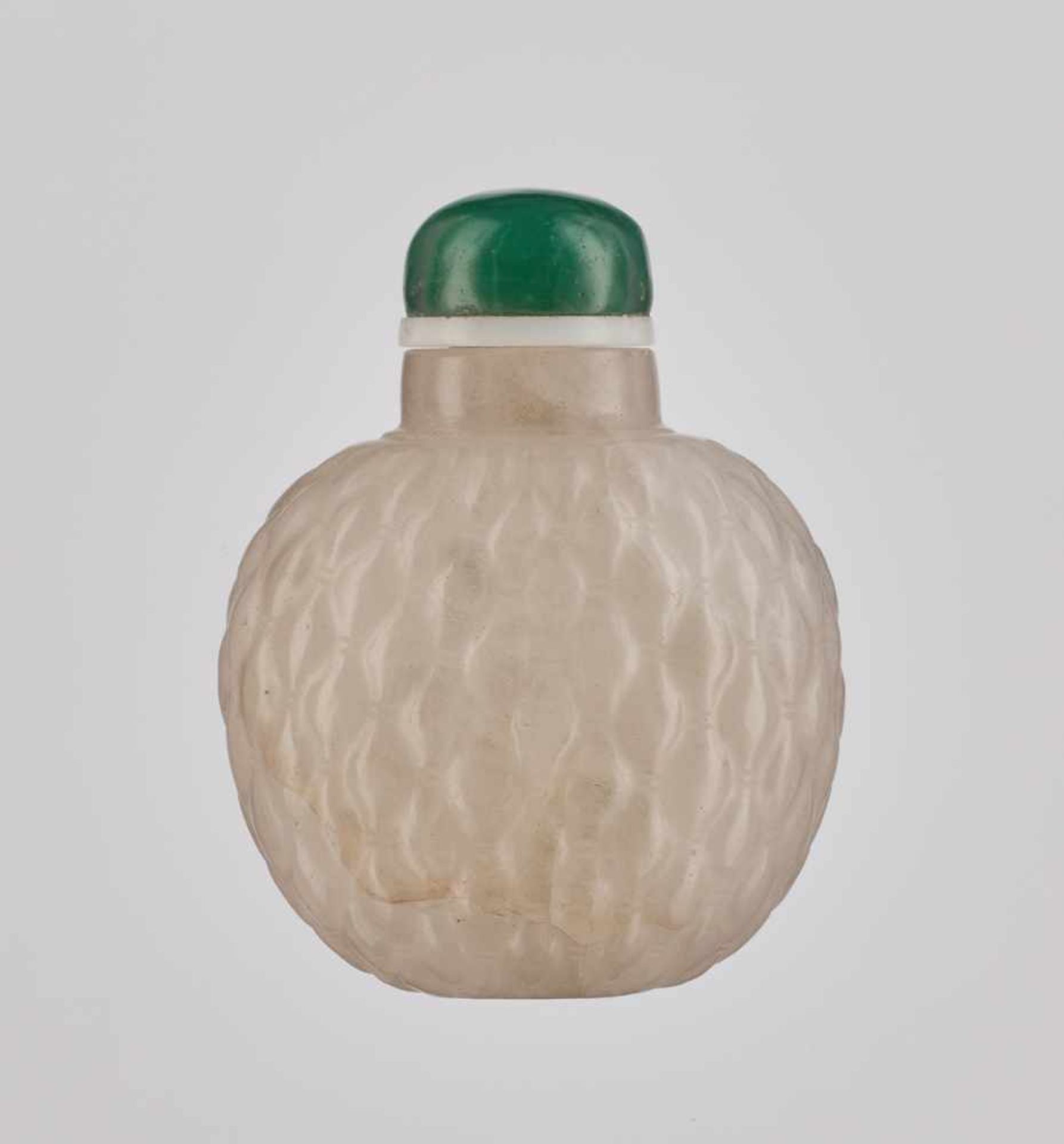 A CARVED CRYSTAL 'BASKETWEAVE' SNUFF BOTTLE, QING DYNASTY Translucent rock crystal, with several