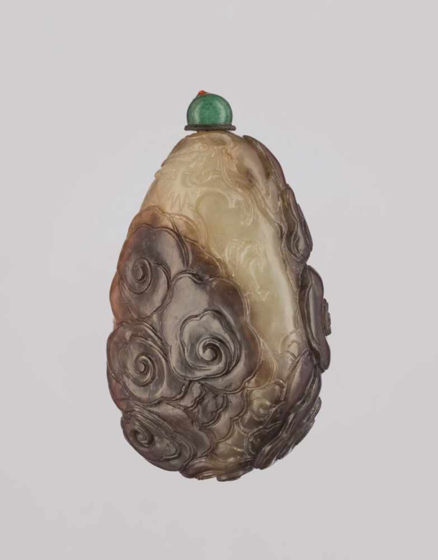 A CELADON AND RUSSET ‘DRAGON AMIDST CLOUDS’ JADE SNUFF BOTTLE Nephrite of dark-brown and celadon