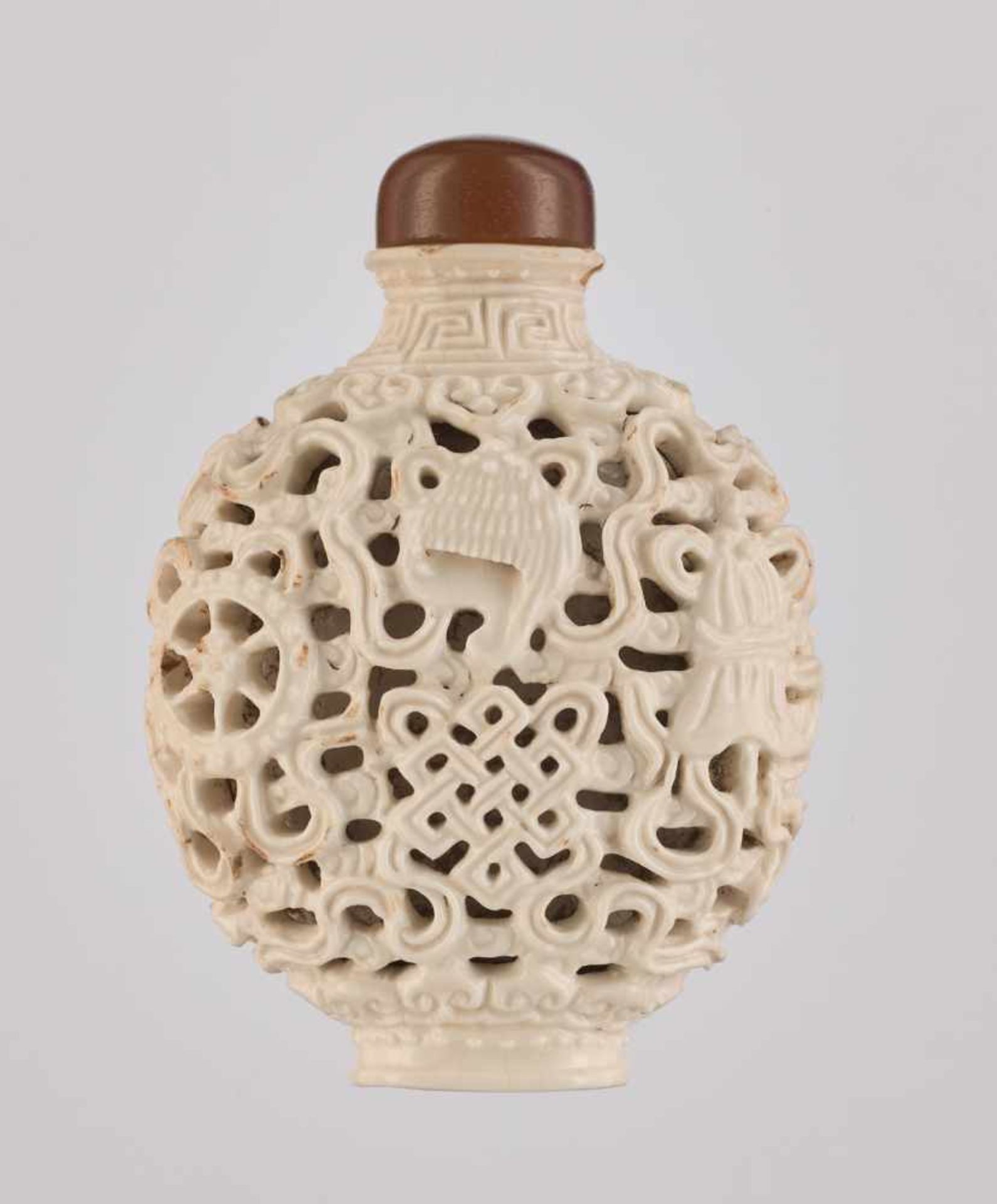 A RETICULATED WHITE PORCELAIN 'BA JIXIANG' SNUFF BOTTLE Crackled creamy-white glaze on molded and - Image 2 of 6