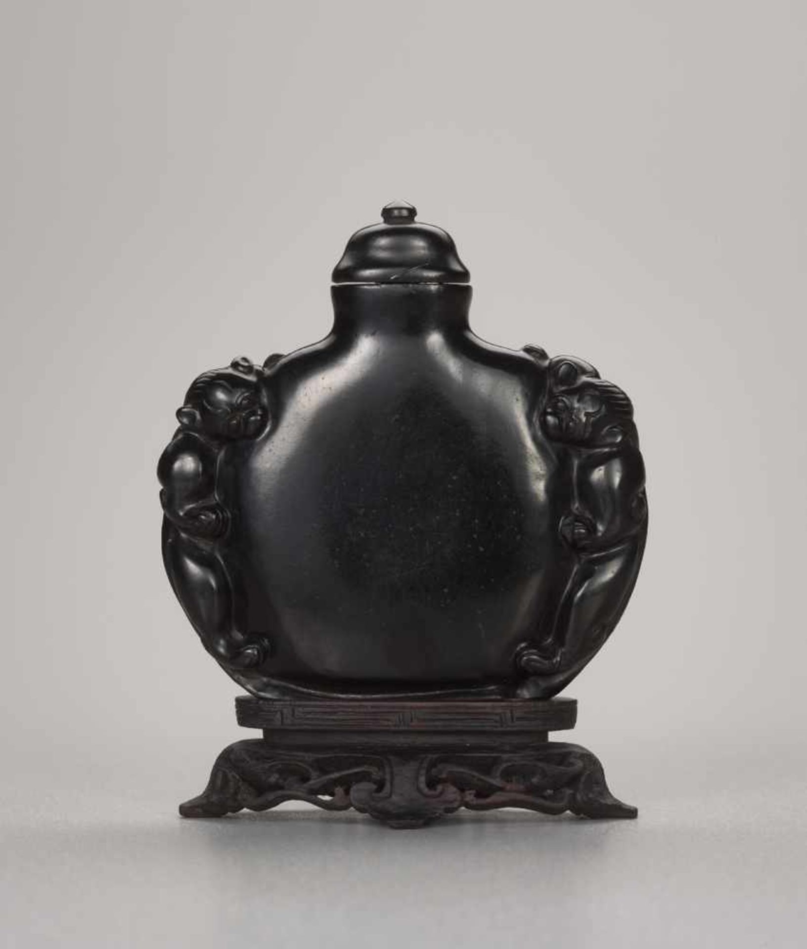 A JET ‘CHILONG’ SNUFF BOTTLE, QING DYNASTY, 18TH - 19TH CENTURY Carved and polished black jet of