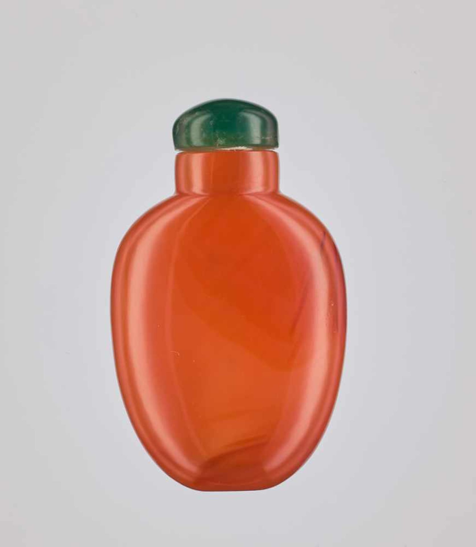 A SMALL PLAIN CARNELIAN SNUFF BOTTLE, QING DYNASTY Plain carnelian of deep orange, almost amber-like