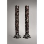 A PAIR OF ZITAN ‘TWO-DRAGON' CANDLESTICKS ON STANDS, QING DYNASTY The Zitan wood with its typical “