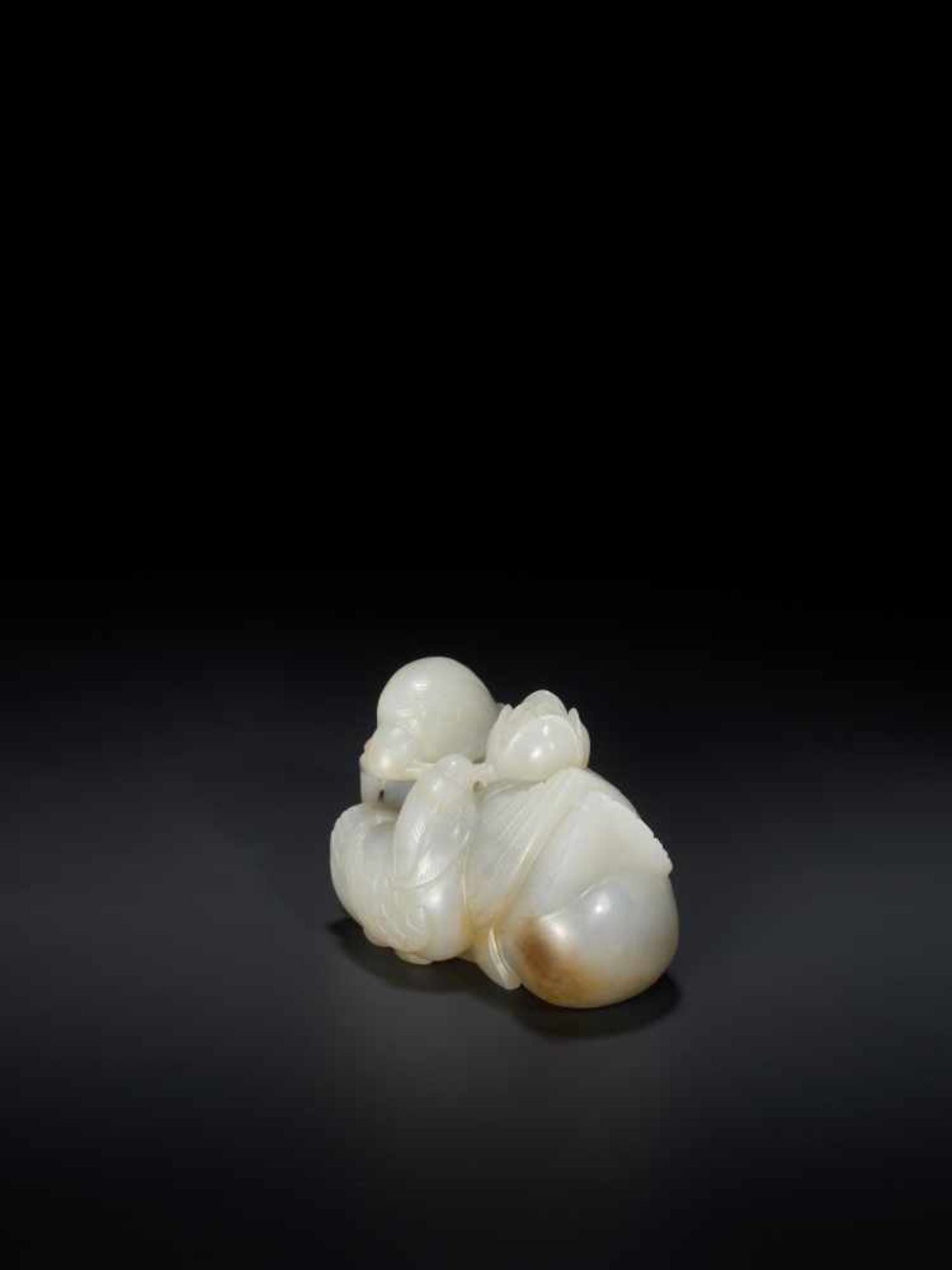 A QING DYNASTY CELADON AND RUSSET JADE ‘MANDARIN DUCKS AND LOTUS’ GROUP Light celadon color jade - Image 4 of 7