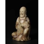 A FINE 17th / 18th CENTURY SOAPSTONE FIGURE OF A LUOHAN Soapstone of a creamy-beige color with