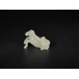 A PALE CELADON 'HORSE AND MONKEY' JADE CARVING, QING DYNASTY, 18TH / 19TH CENTURY The stone of even,