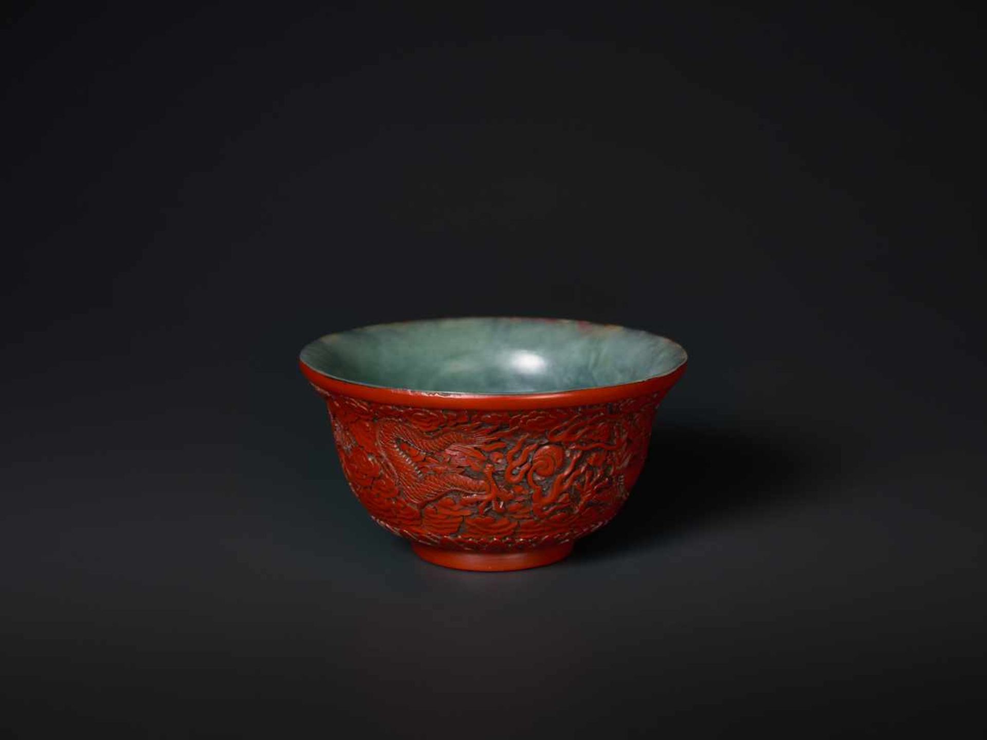 AN EXTREMELY RARE QIANLONG PERIOD CINNABAR LACQUER EMBELLISHED JADE BOWL Celadon and grey streaked - Image 6 of 7