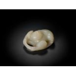 AN 18TH CENTURY JADE ‘BOY AND LOTUS’ CARVING Pale celadon jade of even color and translucent