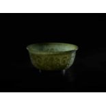 A TRANSLUCENT SPINACH GREEN MUGHAL STYLE ‘LOTUS’ JADE BOWL, QING DYNASTY The jade carved in high