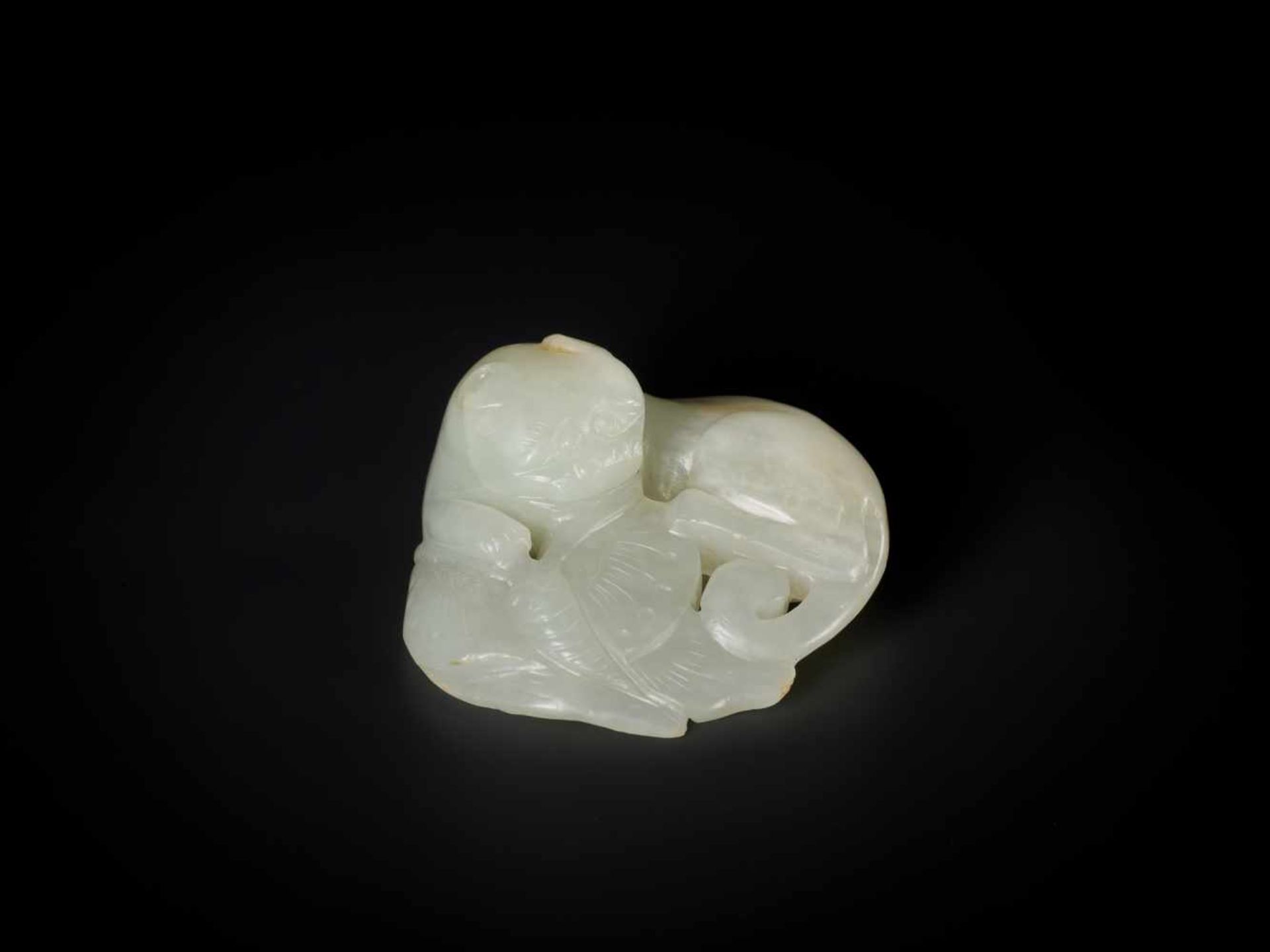 A QING DYNASTY PALE CELADON JADE ‘CAT AND BUTTERFLY’ GROUP Light celadon color jade with russet